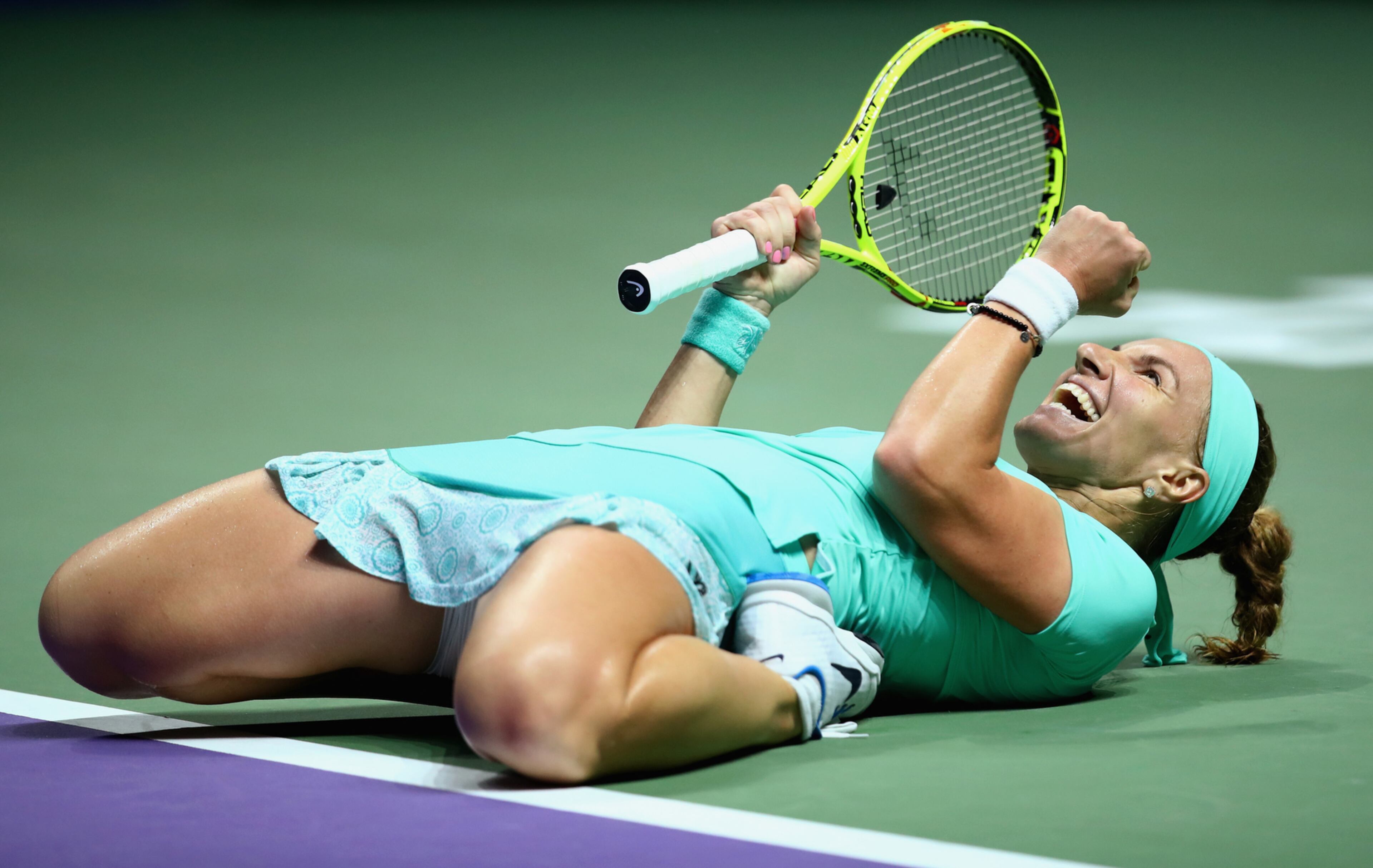 SINGAPORE - OCTOBER 26: Svetlana Kuznetsova of Russia celebrates victory in her singles match against Karolina Pliskova of Czech Republic during day 4 of the BNP Paribas WTA Finals Singapore at Singapore Sports Hub on October 26, 2016 in Singapore. (Photo by Clive Brunskill/Getty Images)