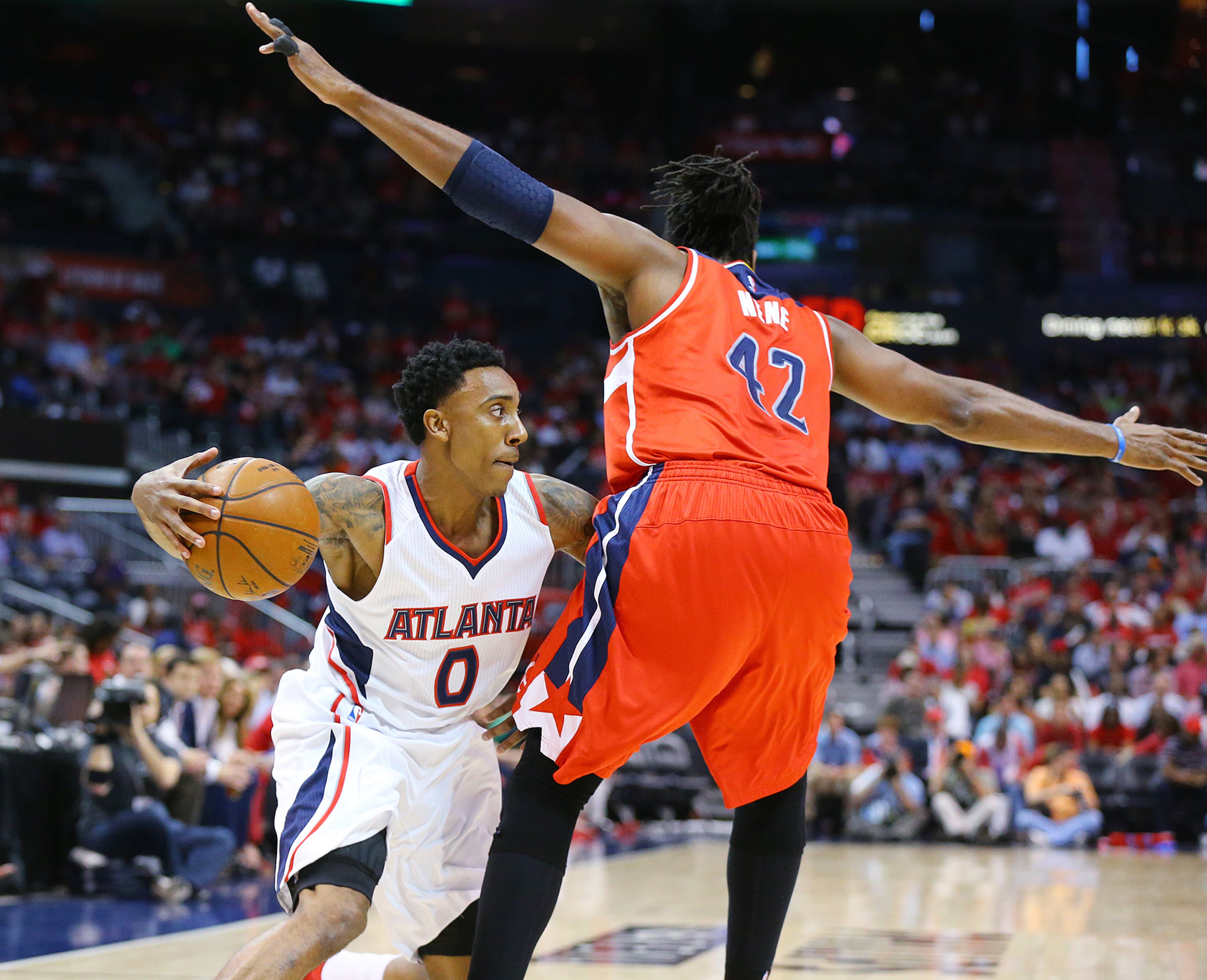 Hawks Jeff Teague looks to drive around Wizards Nene in their Eastern Conference Semifinals game 5 on Tuesday, May 13, 2015, in Atlanta. Curtis Compton / ccompton@ajc.com