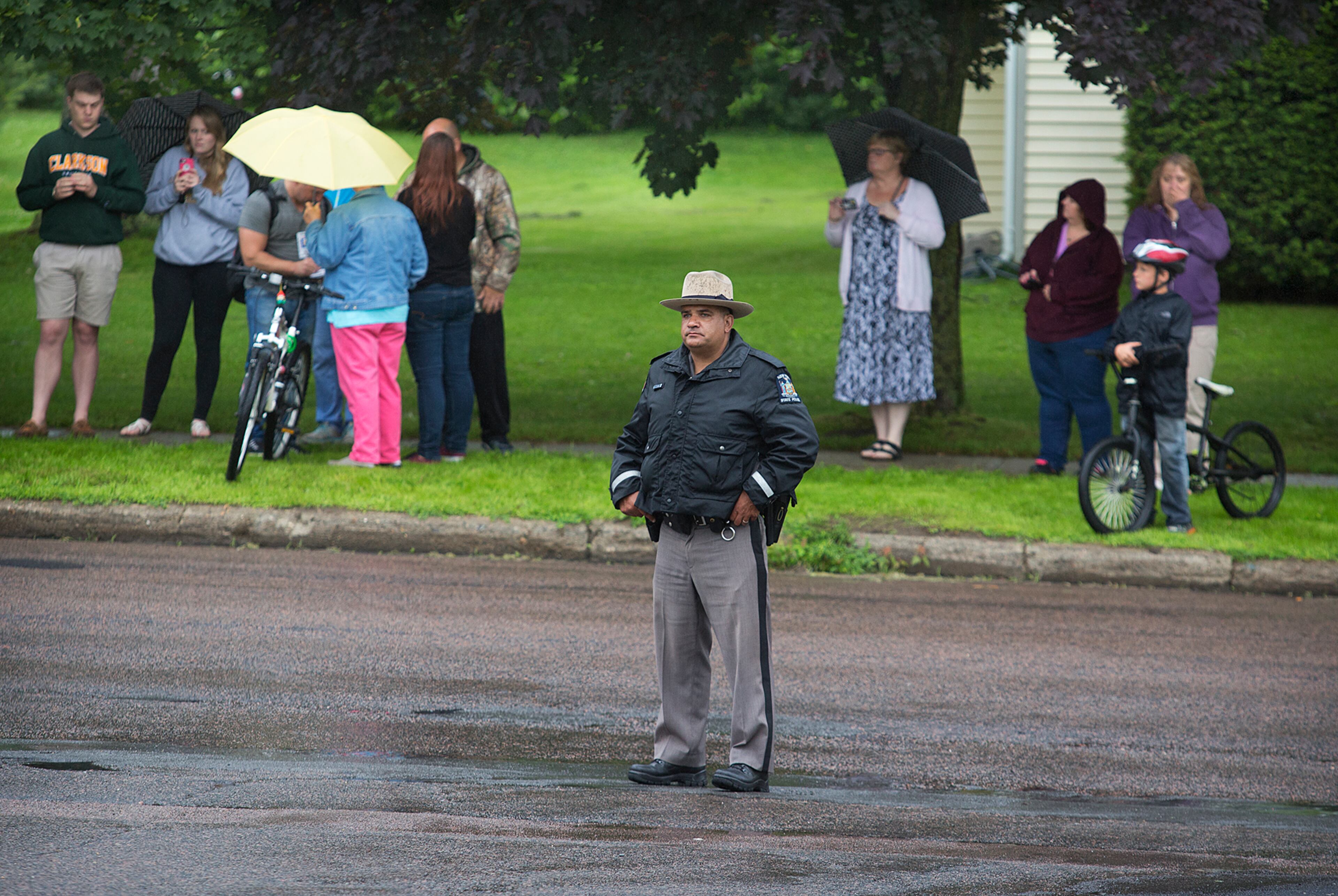A law enforcement officers stands outside Alice Hyde Medical Center in Malone, N.Y., Sunday, June 28, 2015, where David Sweat was taken after being shot and captured. Sweat's capture came two days after his fellow escapee, Richard Matt, was killed in a confrontation with law enforcement while holding a shotgun. Sweat was unarmed when he was shot twice by a state police sergeant as the fugitive ran for a tree line. (Jason Hunter/Watertown Daily Times via AP)