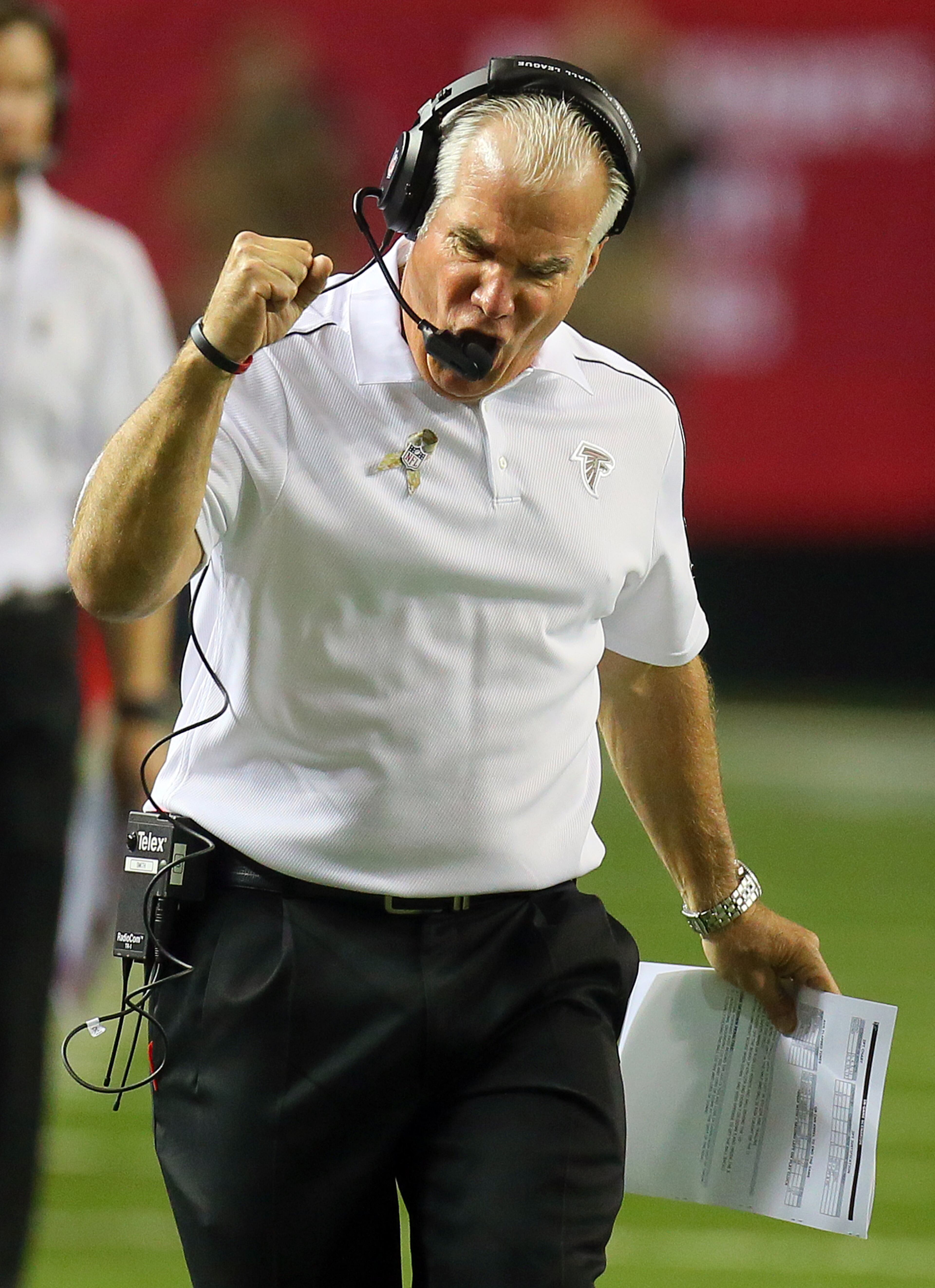 Atlanta Falcons head coach Mike Smith pumps his fist as the Falcons pick up a first down on the final drive of the first half on the way to tieing the game 6-6 with a field goal at the Georgia Dome in Atlanta on Sunday, Nov. 4, 2012. CURTIS COMPTON / CCOMPTON@AJC.COM