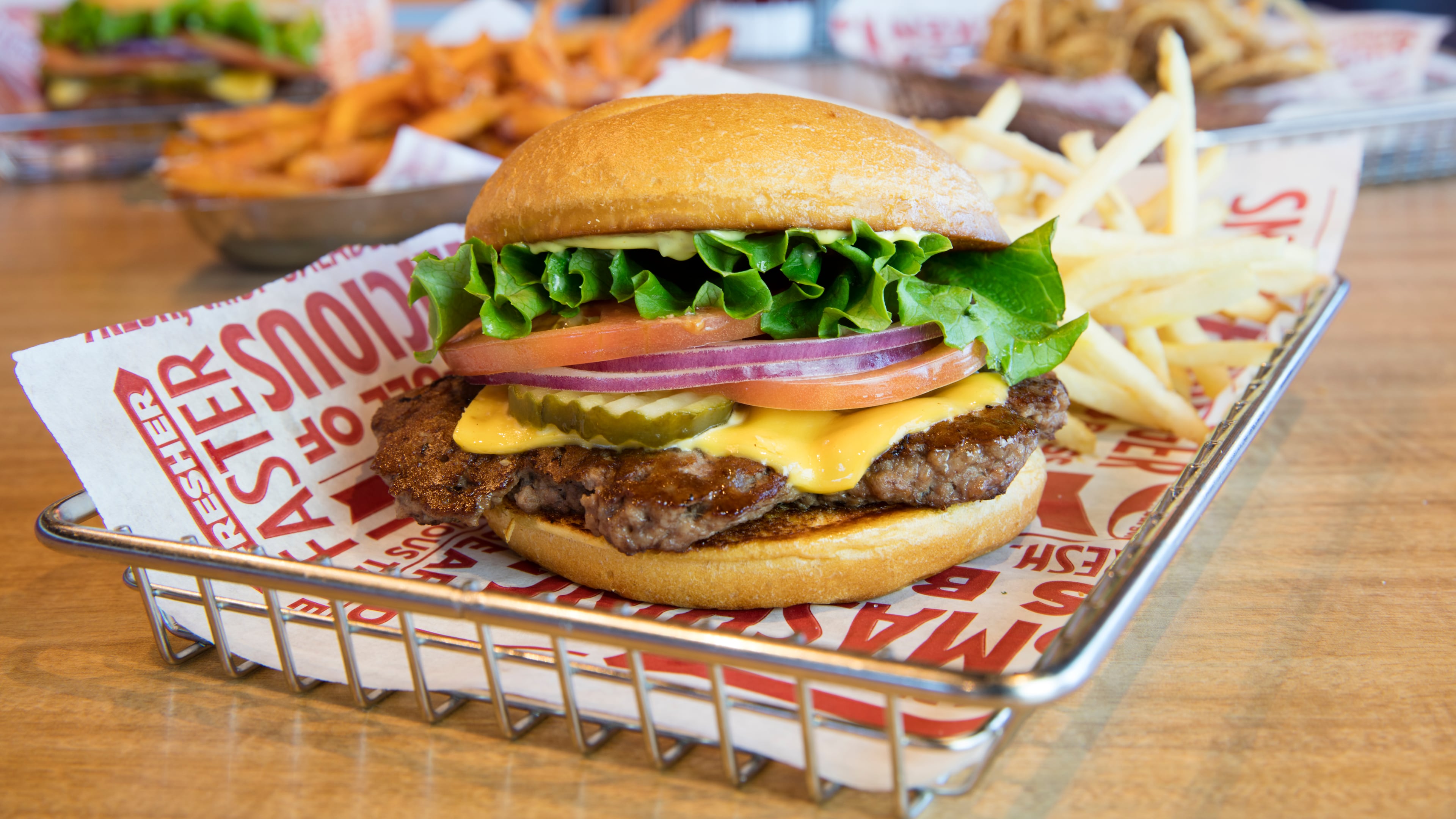 Stop in Smashburger in Locust Grove today to receive a free burger and more. Photo credit: Smashburger.