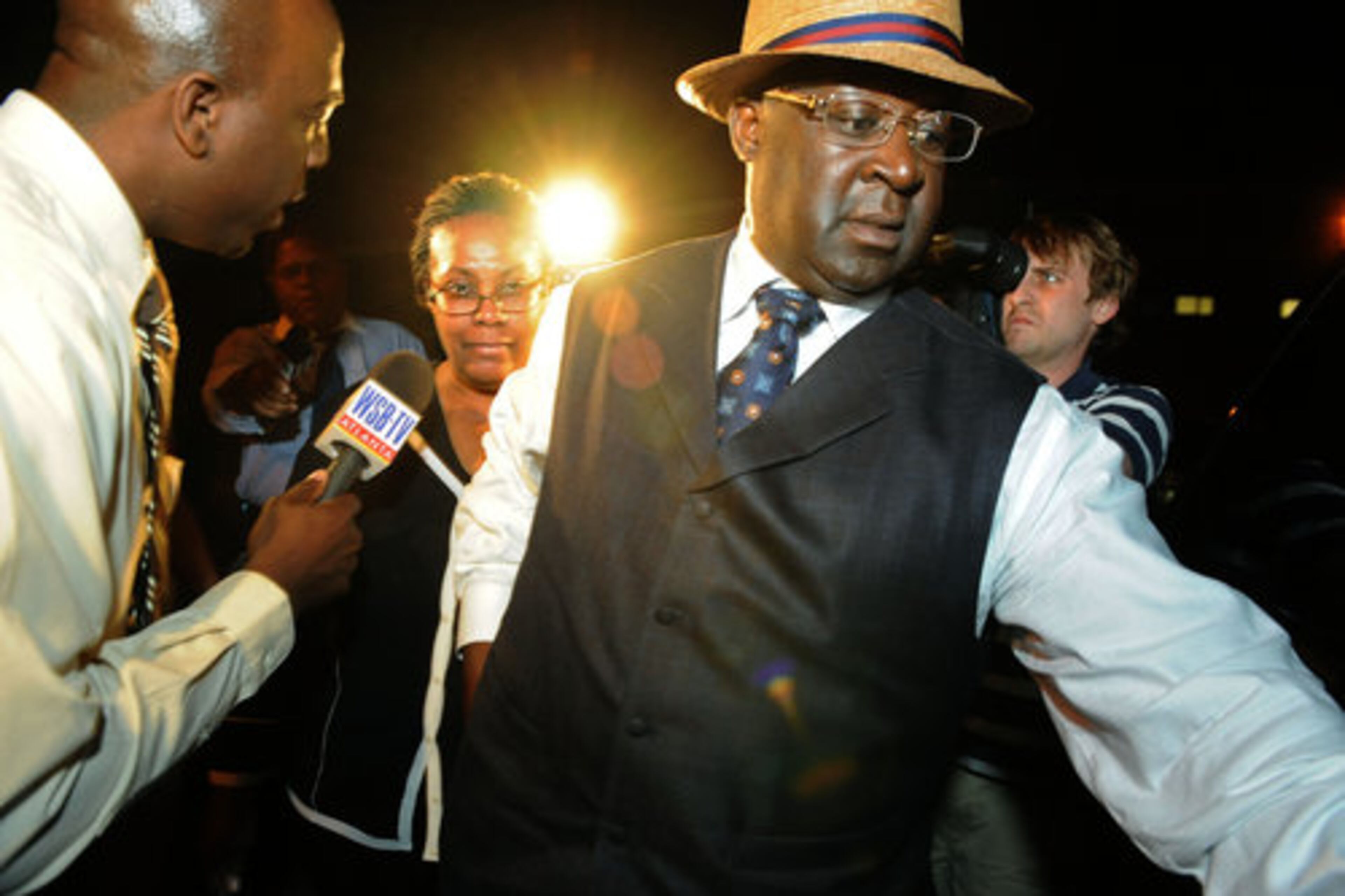 Sheila Michael's husband escorts her to a car after she was released from Fulton County Jail Thursday night. She is accused of concealing evidence connecting her daughter to a hit-and-run crash that killed five people,