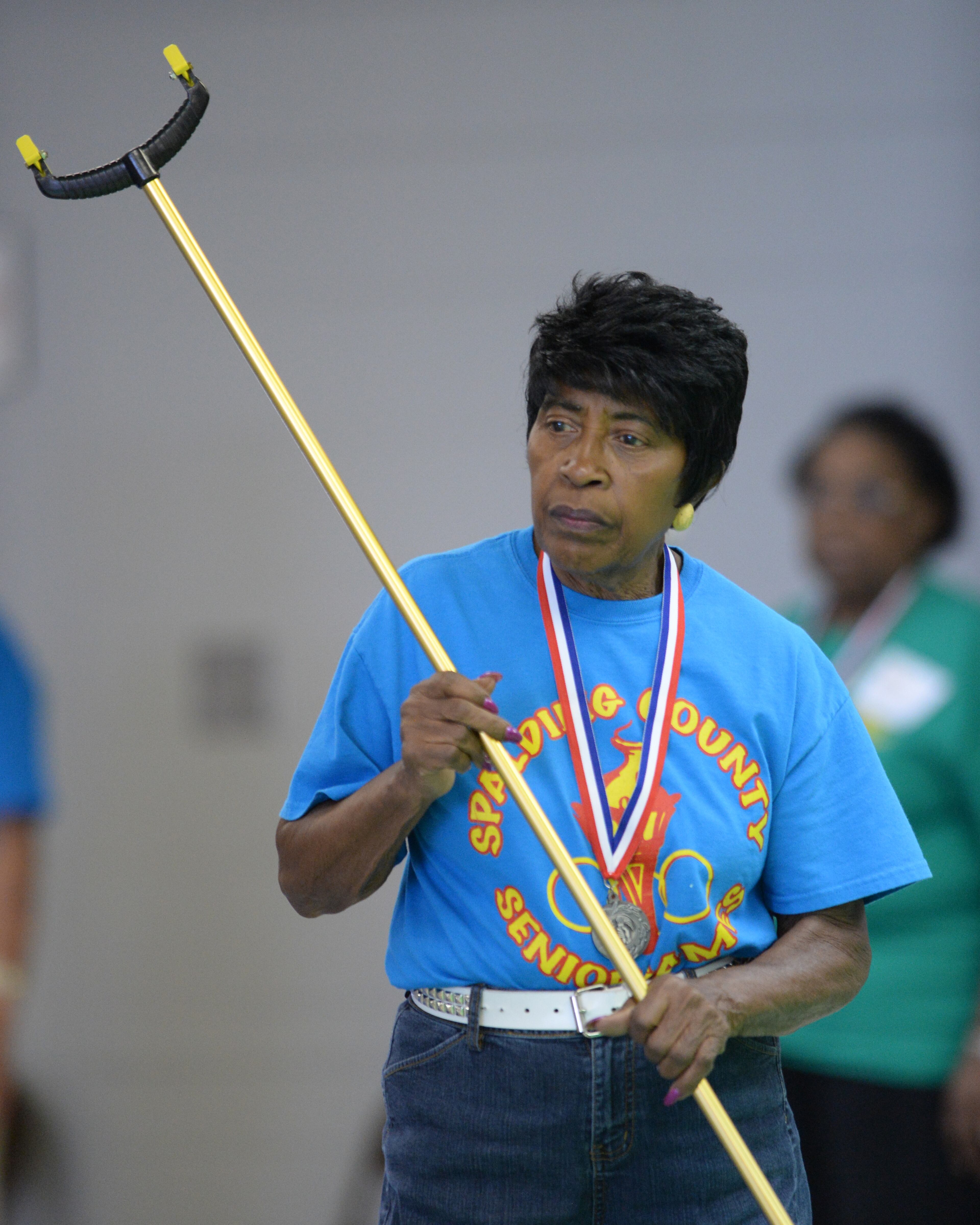 Martha Beck,79, Griffin, Georgia watches her partner during the shuffleboard competition at the 31st Annual Georgia Golden Olympics in Warner Robins, Georgia on Thursday, September 19, 2013. Over 430 seniors from age 50 to 92 competed in track & field, swimming, horse shoes, bowling, cycling, checkers, wheelchair, billiards, tennis, and archery. The games started on September 18, 2013 and end on September 21, 2013.