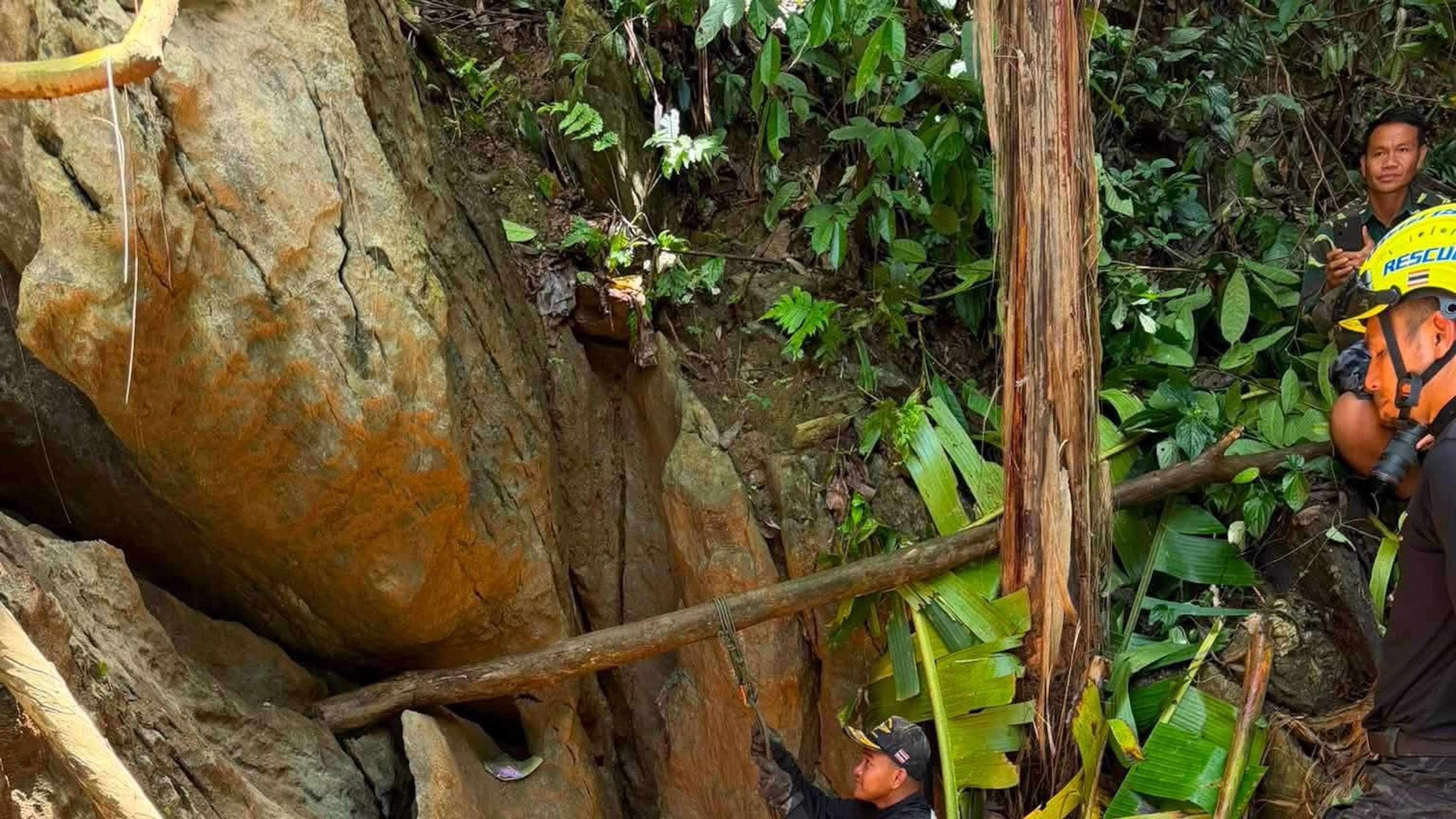 In this release Metta Tham Rescue Kalasin, rescuers work to reach seven people who have been trapped in a cave in Xaisomboun province, Laos, Monday, May 25, 2026. (Metta Tham Rescue Kalasin via AP)