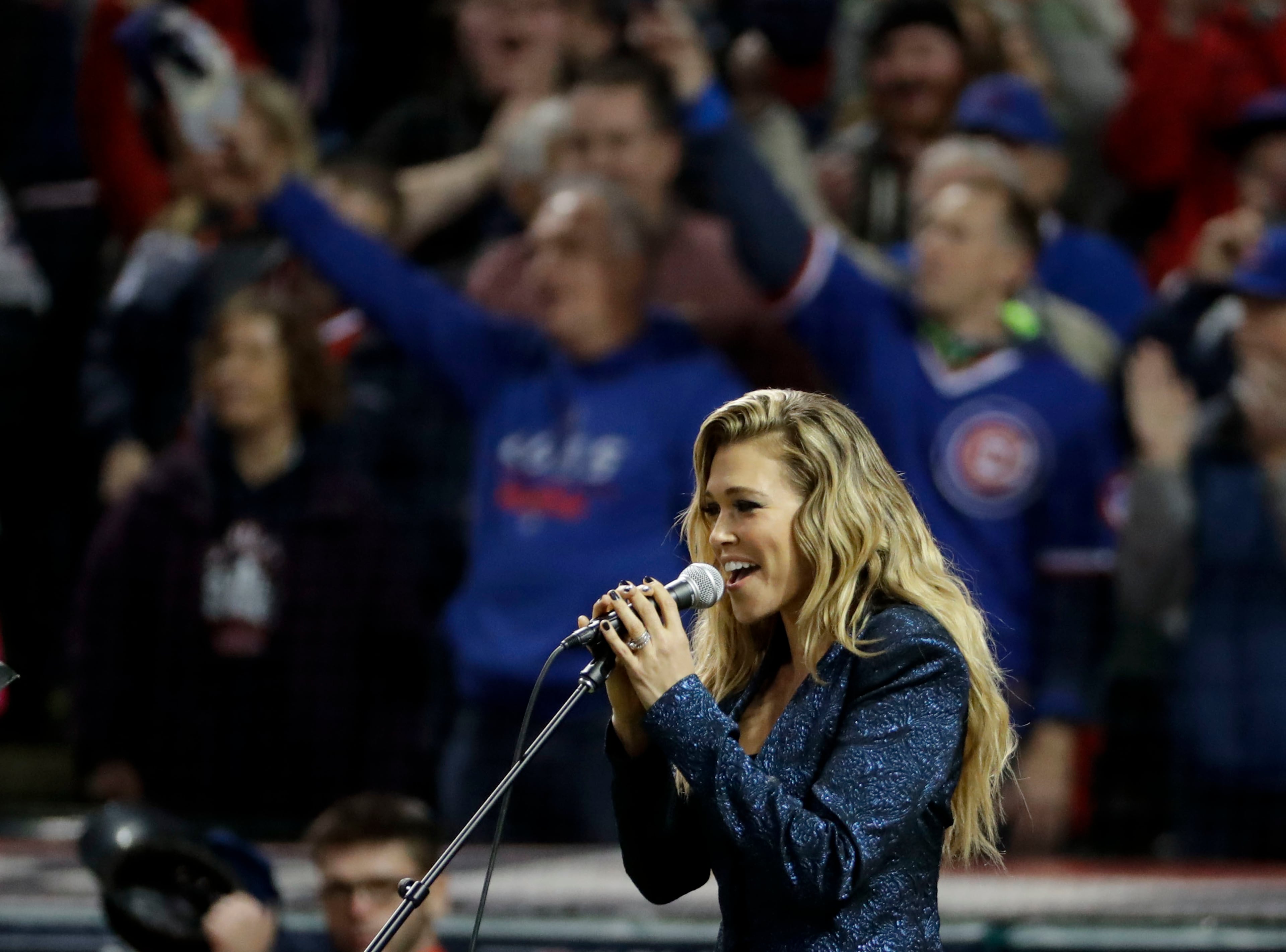 International pop star Rachel Platten sings the national anthem before Game 1 of the Major League Baseball World Series between the Cleveland Indians and the Chicago Cubs Tuesday, Oct. 25, 2016, in Cleveland. (AP Photo/Matt Slocum)