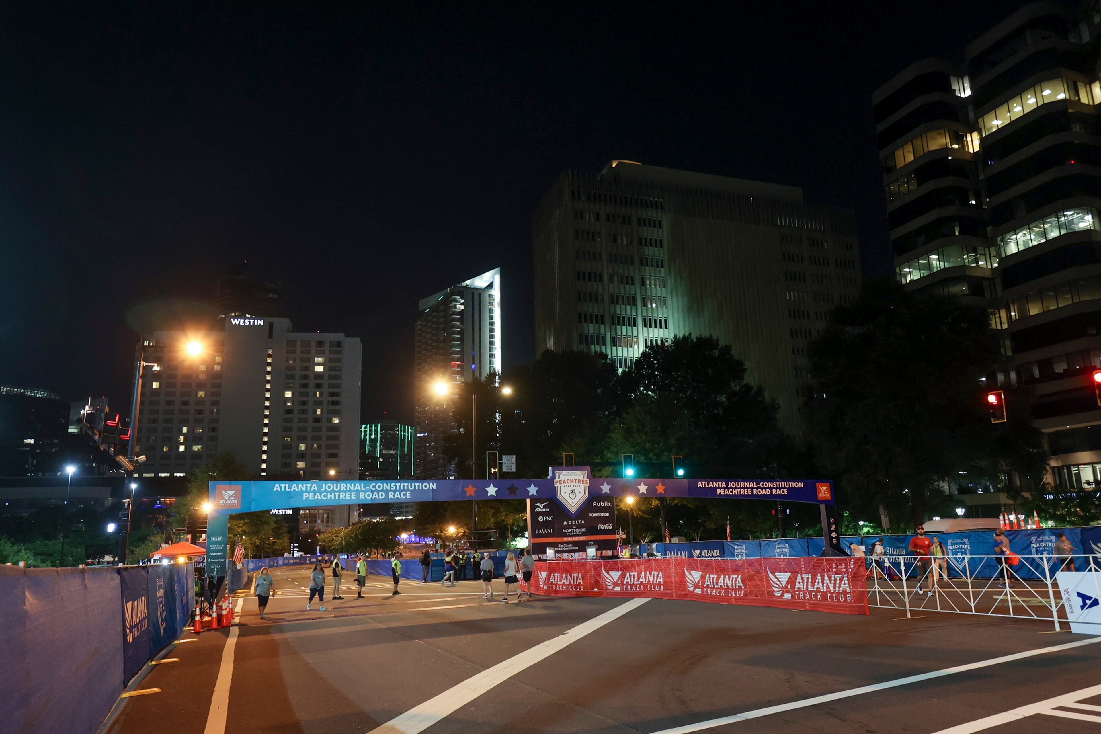 7/3/21 - Atlanta, GA - Preparations at the start as the AJC Peachtree Road Race returned in-person Saturday for the holiday tradition. (Jason Getz for the Atlanta Journal-Constitution)