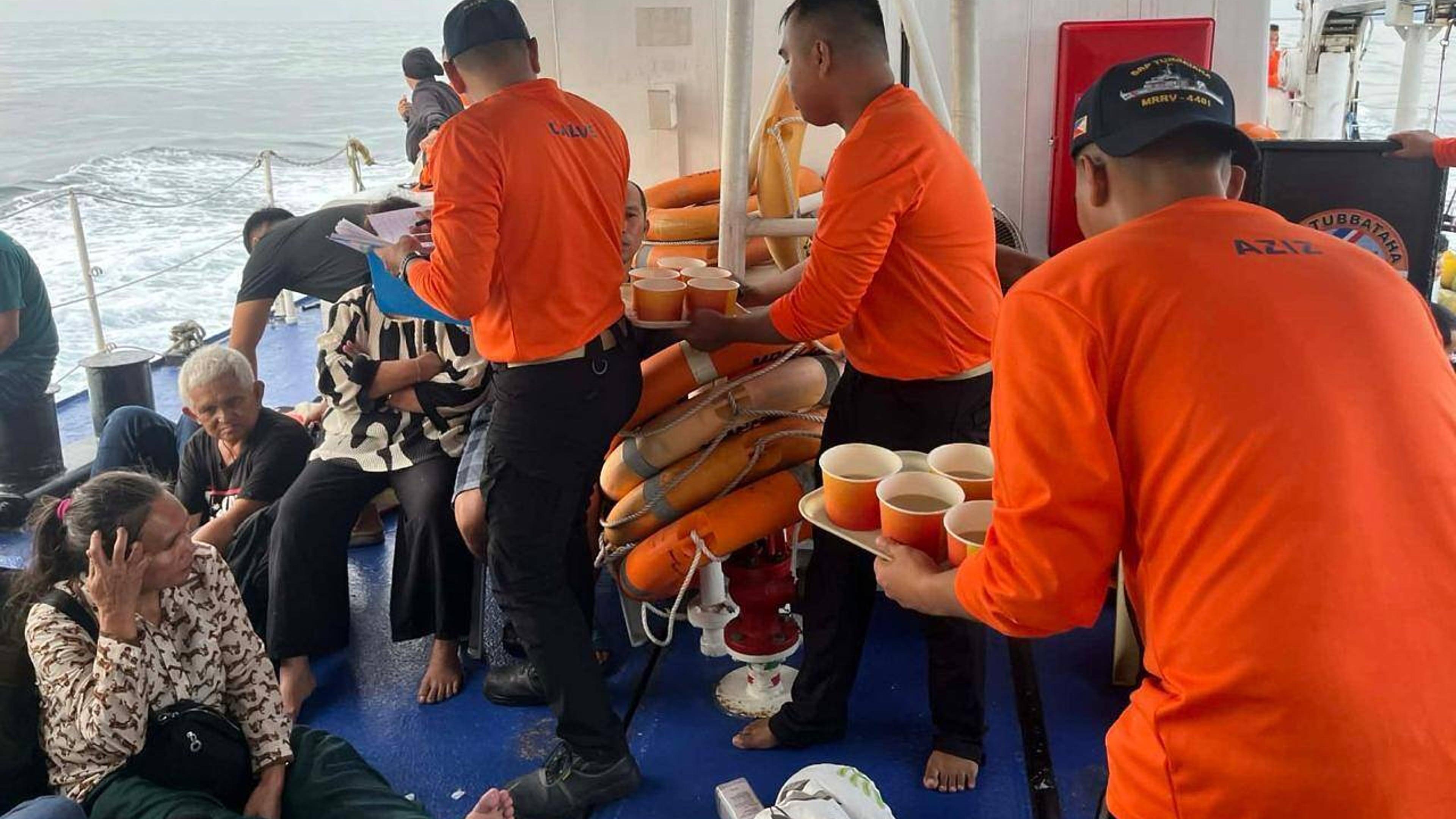This photo released by the Philippine Coast Guard shows its personnel tending to people who were aboard the M/V Trisha Kerstin 3 around the waters of Baluk-Baluk Island, Basilan, Philippines Monday, Jan. 26, 2026. (Philippine Coast Guard via AP)