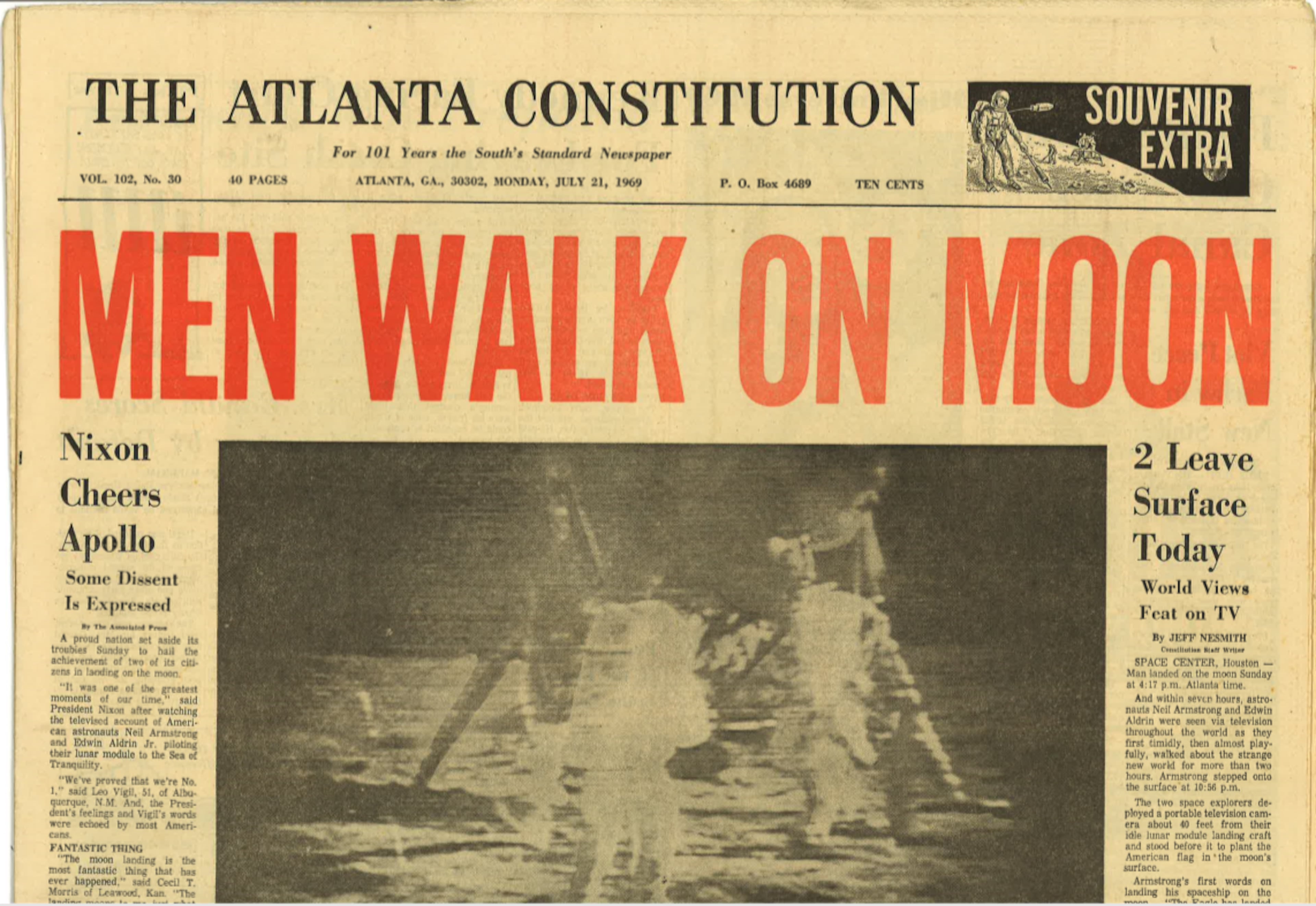 An Atlanta Constitution front page from Monday morning, July 21, the morning after the moon walk, was marked as a "souvenir extra" with a headline, Men Walk on Moon above a photo of Armstrong and Aldrin on the lunar surface the night before. (AJC archives)