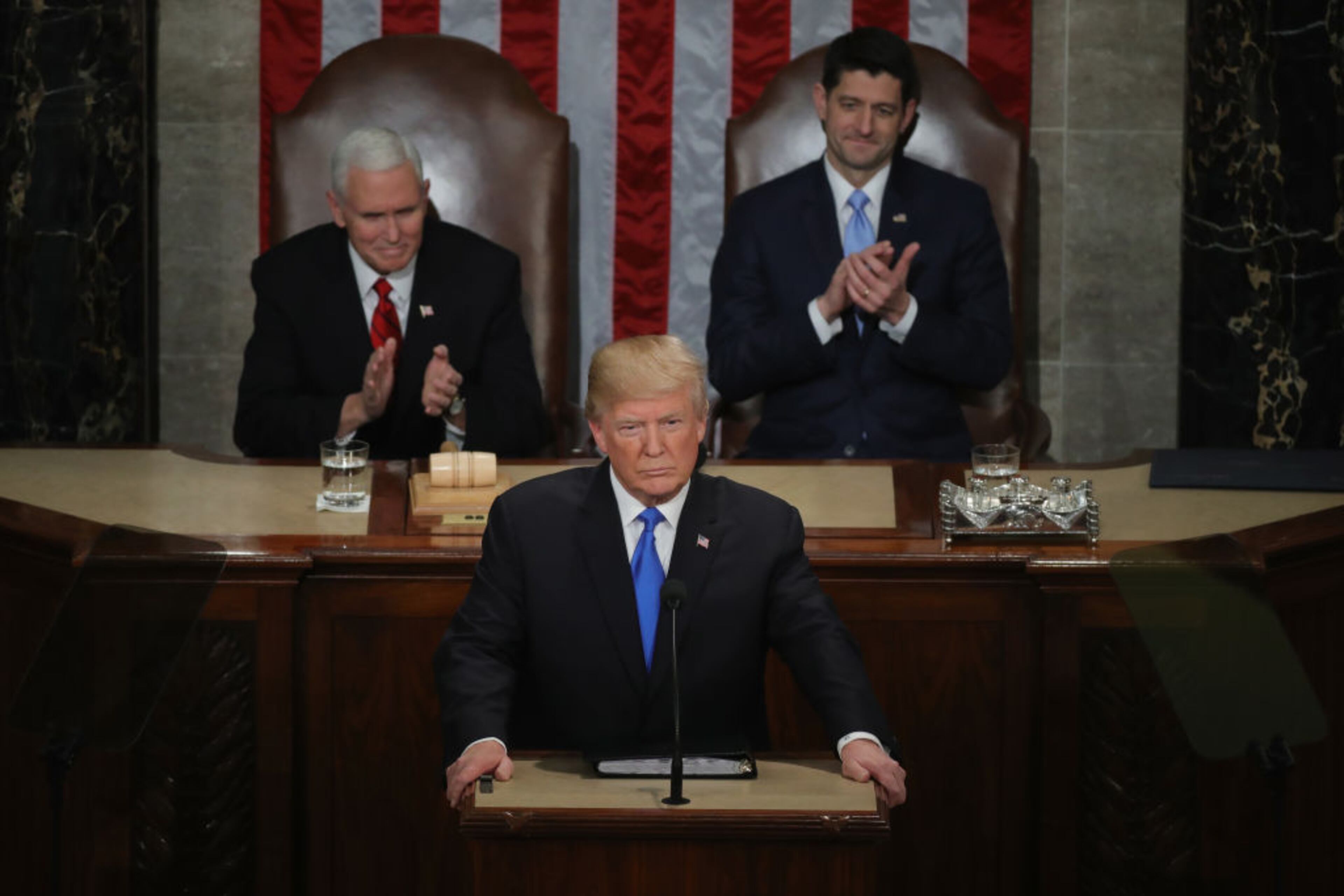WASHINGTON, DC - JANUARY 30: U.S. President Donald J. Trump delivers the State of the Union address as U.S. Vice President Mike Pence (L) and Speaker of the House U.S. Rep. Paul Ryan (R-WI) (R) look on in the chamber of the U.S. House of Representatives January 30, 2018 in Washington, DC. This is the first State of the Union address given by U.S. President Donald Trump and his second joint-session address to Congress. (Photo by Chip Somodevilla/Getty Images)