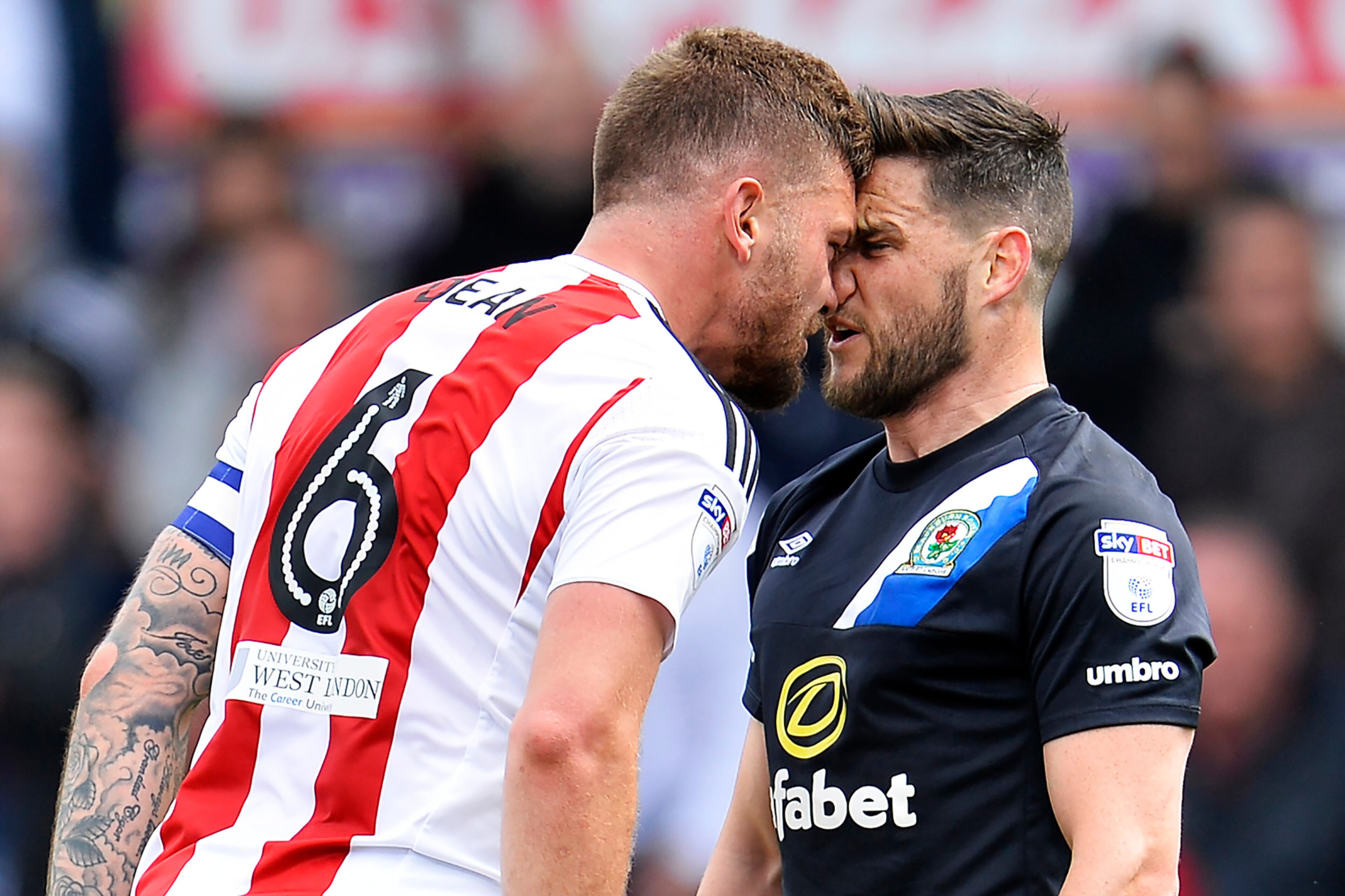 BRENTFORD, ENGLAND - MAY 07: Harlee Dean of Brentford and Craig Conway of Blackburn Rovers confront each other during the Sky Bet Championship match between Brentford and Blackburn Rovers at Griffin Park on May 7, 2017 in Brentford, England. (Photo by Justin Setterfield/Getty Images) *** BESTPIX ***