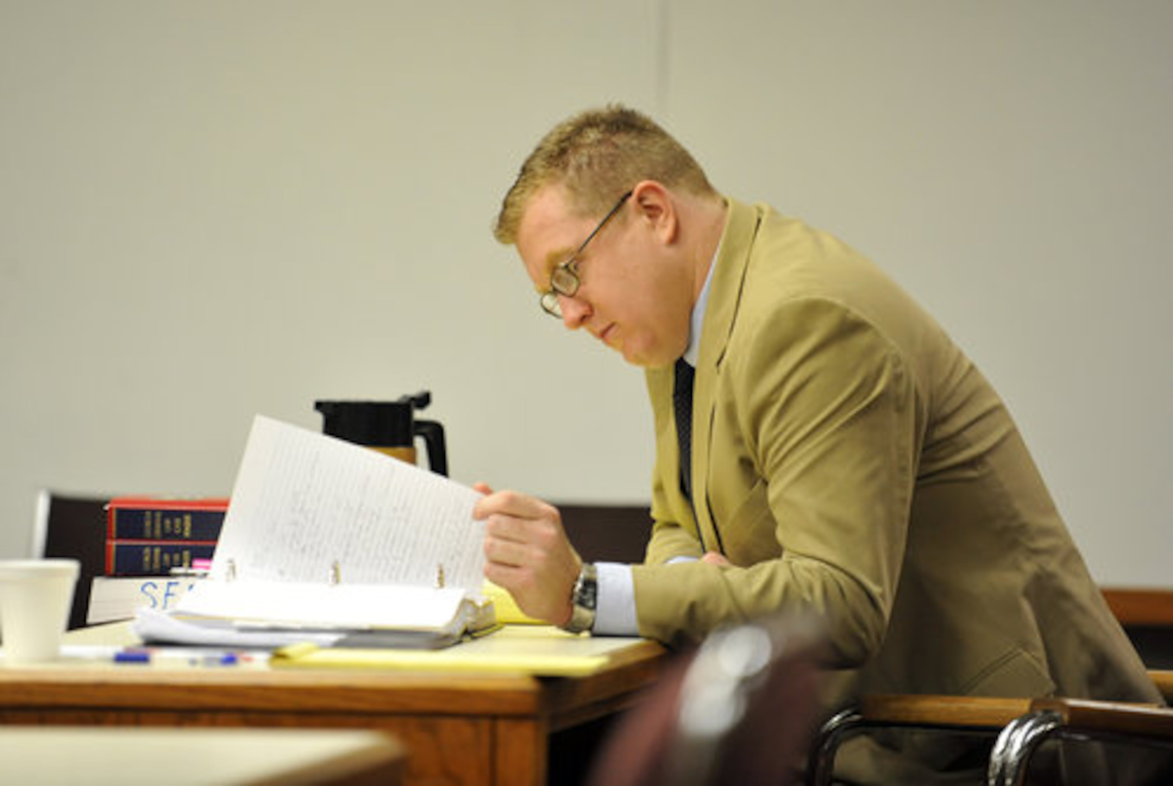 Former Marietta High School teacher, Christopher King looks over notes during a break in his trial Dec. 8, 2009. King is charged with sexual assault against a person in custody after it was discovered he was having a sexual relationship with a student. King was the adviser of the school newspaper in which the student was involved.