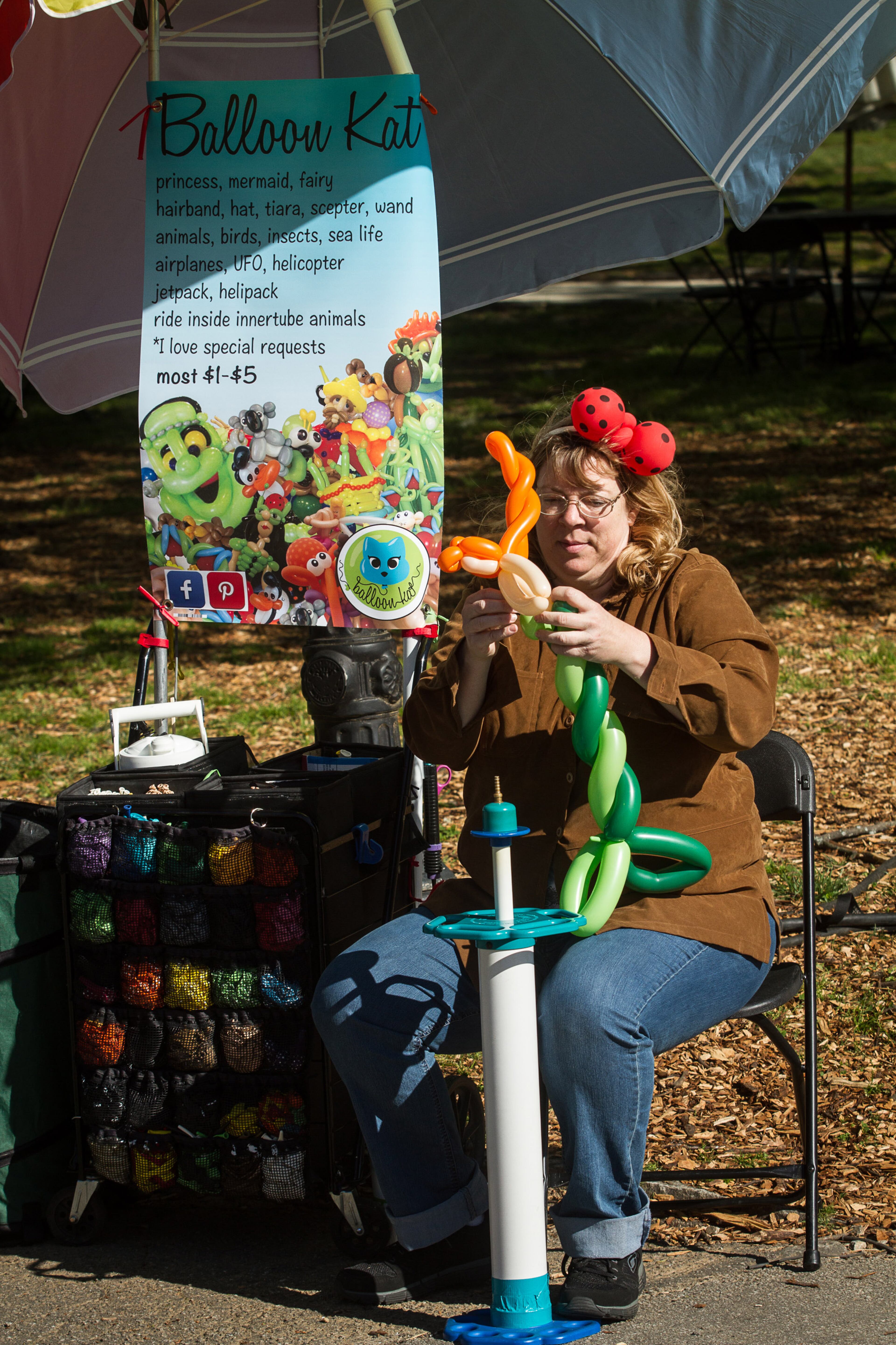 Kat Moore gets ready for the day making balloons at the 80th Annual Atlanta Dogwood Festival in Piedmont Park in Midtown on Saturday morning April 9, 2016. STEVE SCHAEFER / SPECIAL TO THE AJC