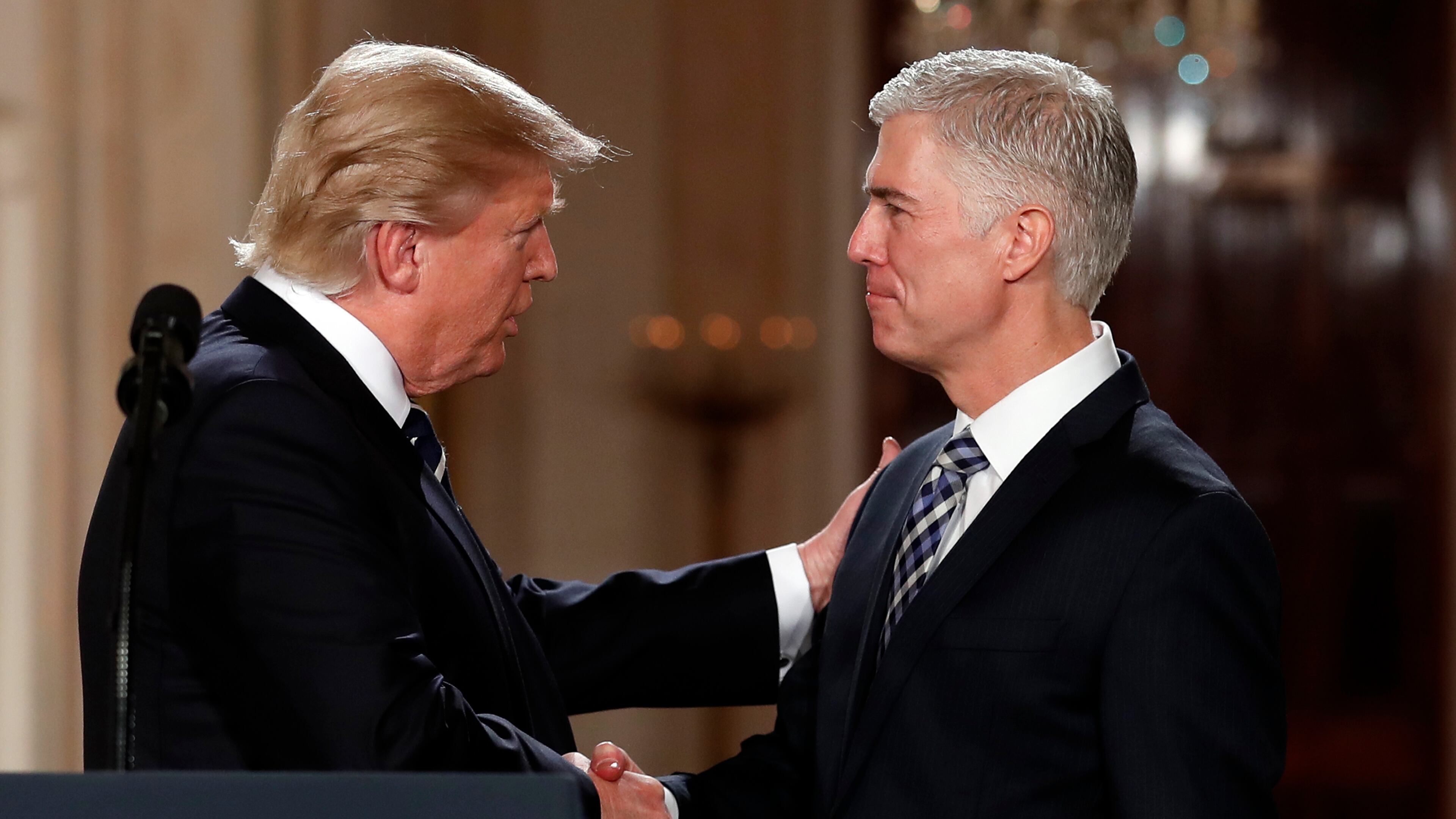 President Donald Trump shakes hands with 10th U.S. Circuit Court of Appeals Judge Neil Gorsuch, his choice for Supreme Court associate justice in the East Room of the White House in Washington, Tuesday, Jan. 31, 2017. (AP Photo/Carolyn Kaster)