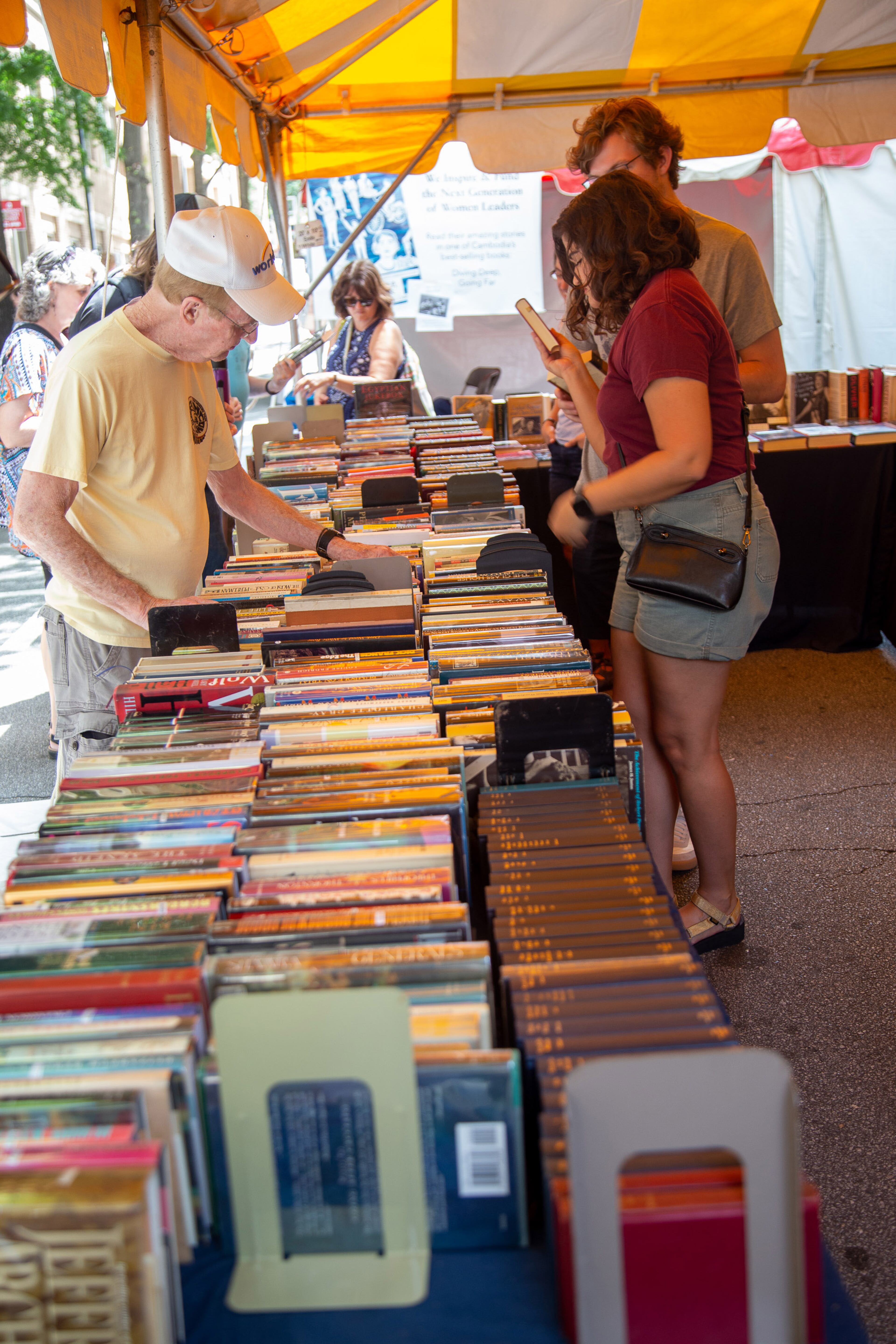People look over books for sale during the AJC Decatur Book Festival on Sunday, September 1, 2019. STEVE SCHAEFER / SPECIAL TO THE AJC