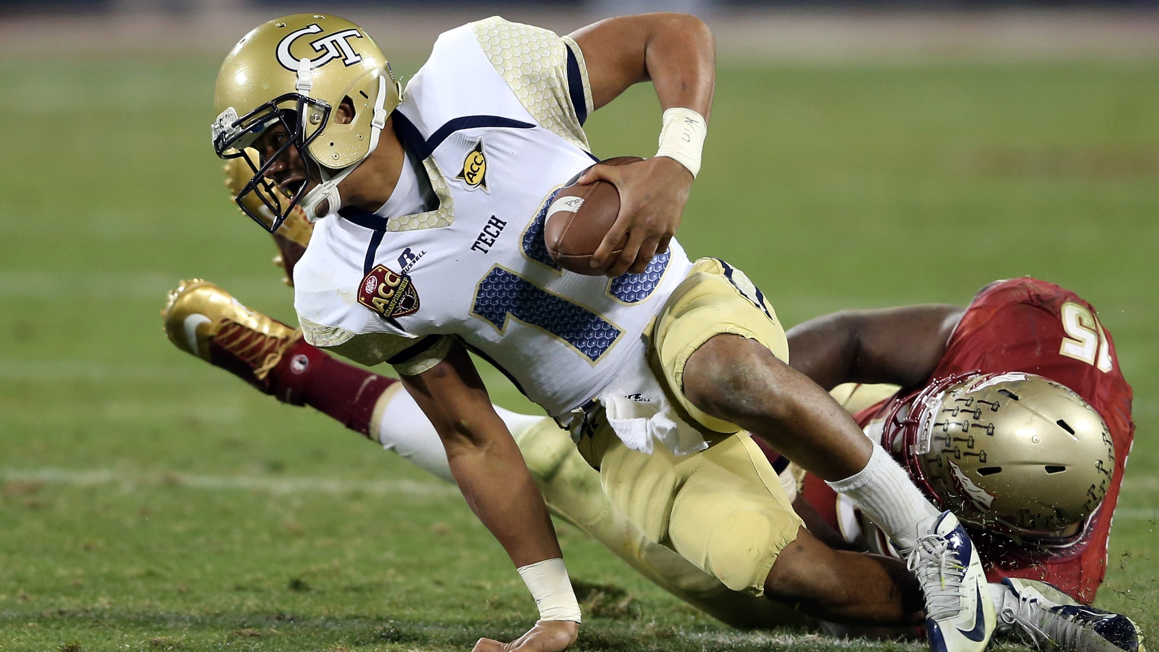 CHARLOTTE, NC - DECEMBER 01: Mario Edwards Jr. #15 of the Florida State Seminoles tackles Tevin Washington #13 of the Georgia Tech Yellow Jackets during the 2012 ACC Championship game at Bank of America Stadium on December 1, 2012 in Charlotte, North Carolina. (Photo by Streeter Lecka/Getty Images)