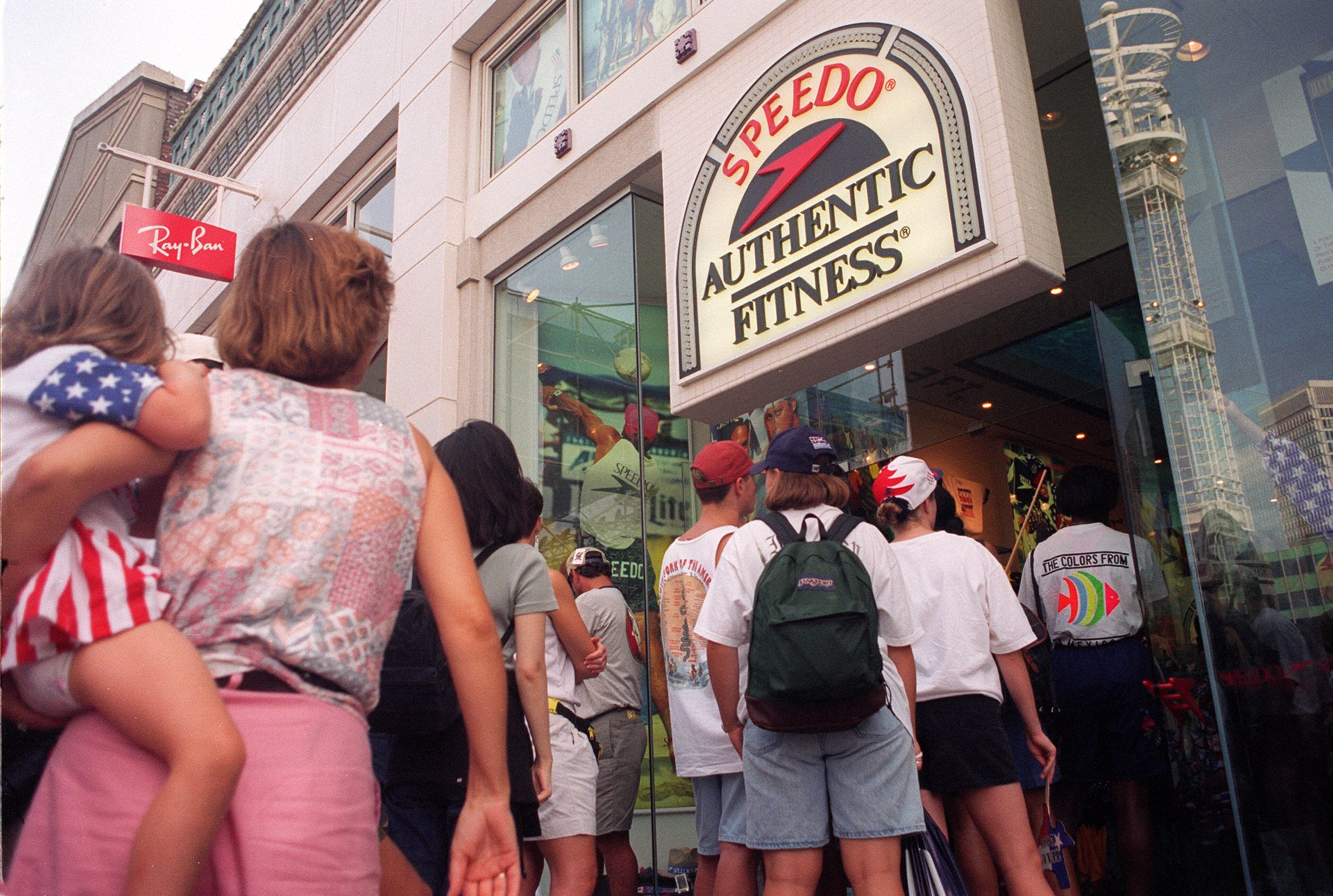 Crowds line up outsidce the Speedo store at Underground Atlanta on Saturday afternoon, August 3, 1996 for Speedo's clearance sale of Olympic items at the Olympic stadium during the 1996 Summer Olympic Games in Atlanta, Georgia.