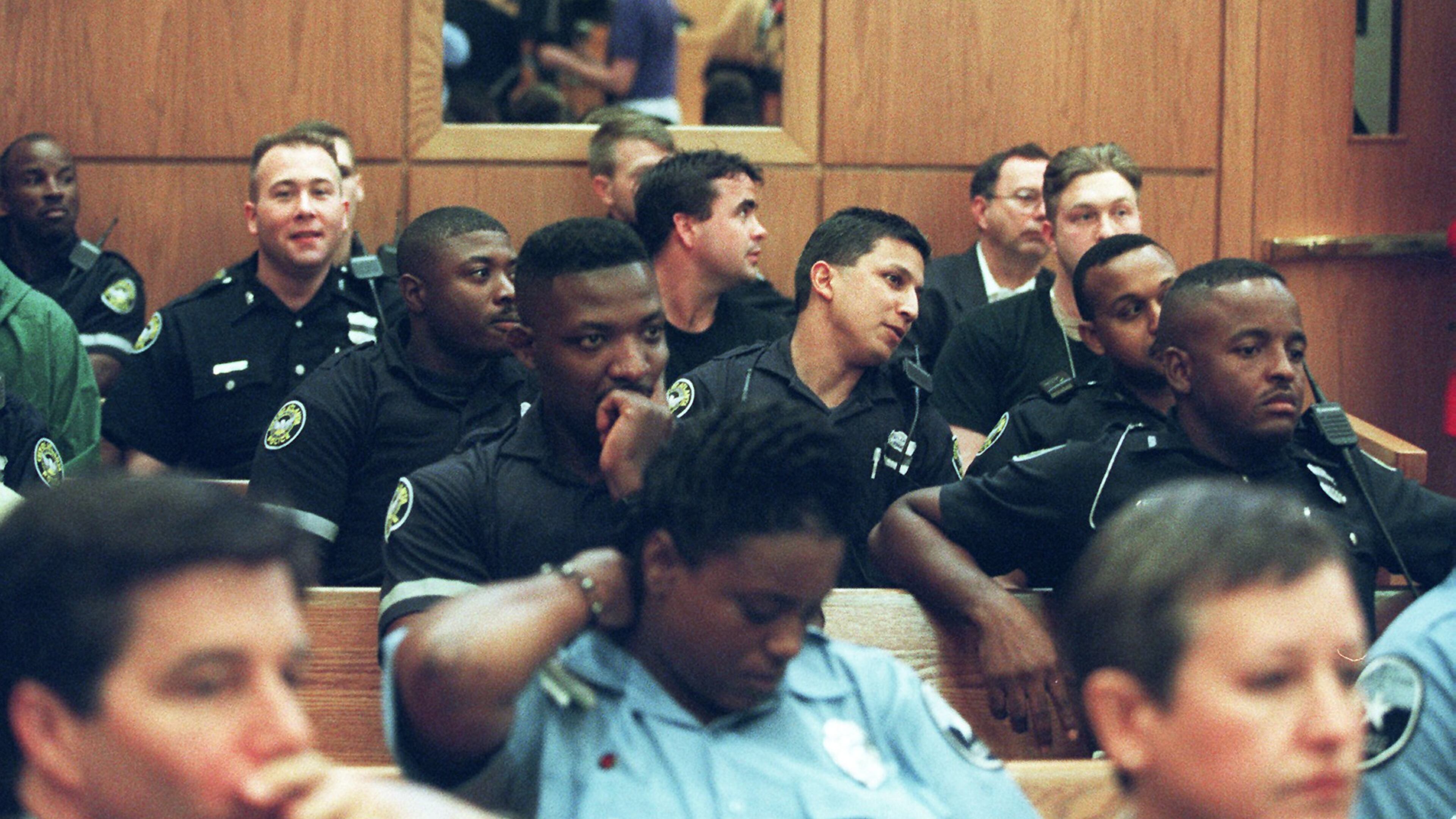 Atlanta police officers packed the Municipal Court in Atlanta on Oct. 14, 1997, for the arraignment of Gregory Lawler, who stood accused of killing one Atlanta police officer and critically wounding another before holding the department at bay for hours. Lawler, now 64, is scheduled to be executed on Oct. 19, 2016, at 7 p.m. (Dwight Ross Jr. / AJC 1997 file photo)