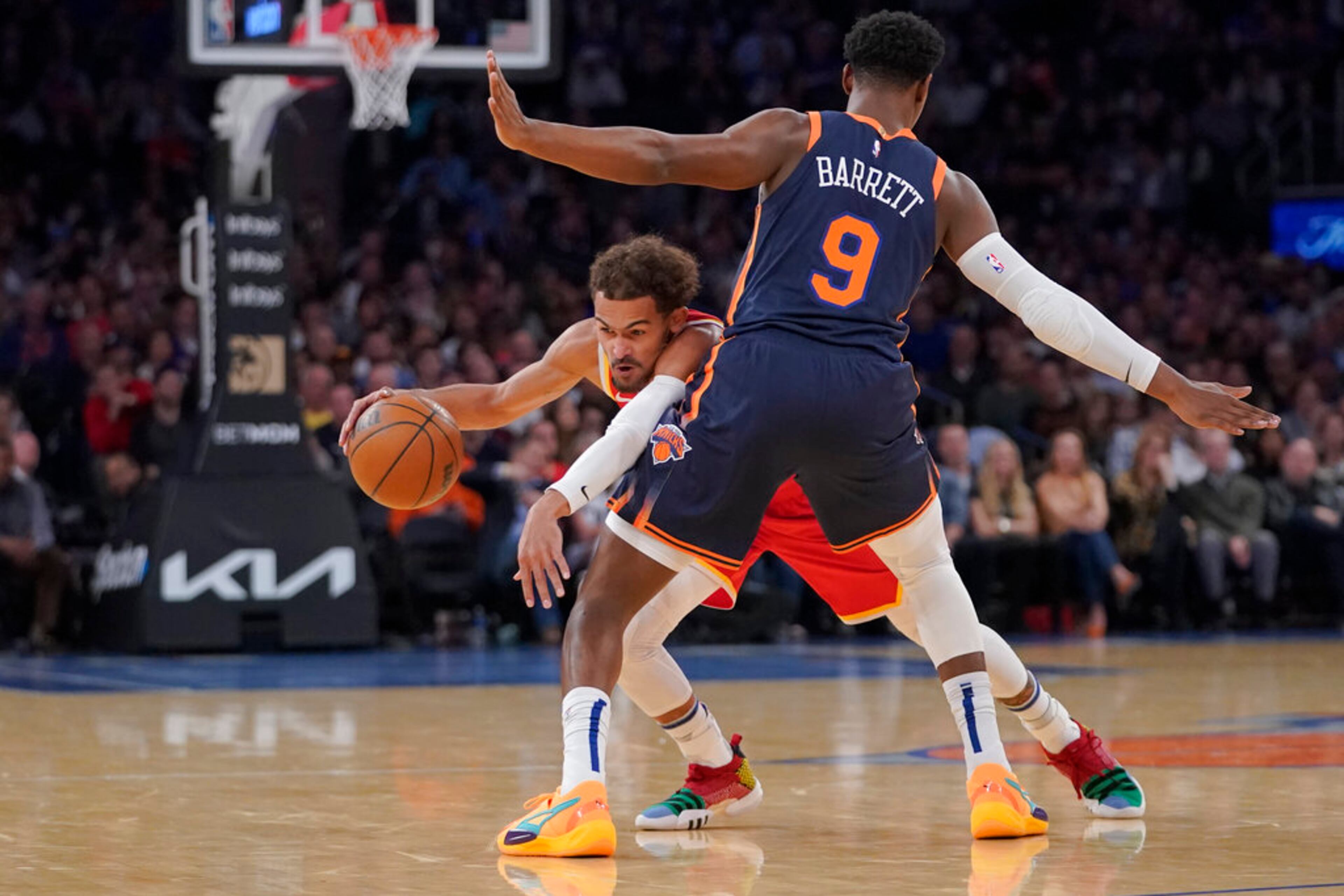 New York Knicks guard RJ Barrett (9) guards Atlanta Hawks guard Trae Young during the first half of an NBA basketball game Wednesday, Nov. 2, 2022, at Madison Square Garden in New York. (AP Photo/Mary Altaffer)
