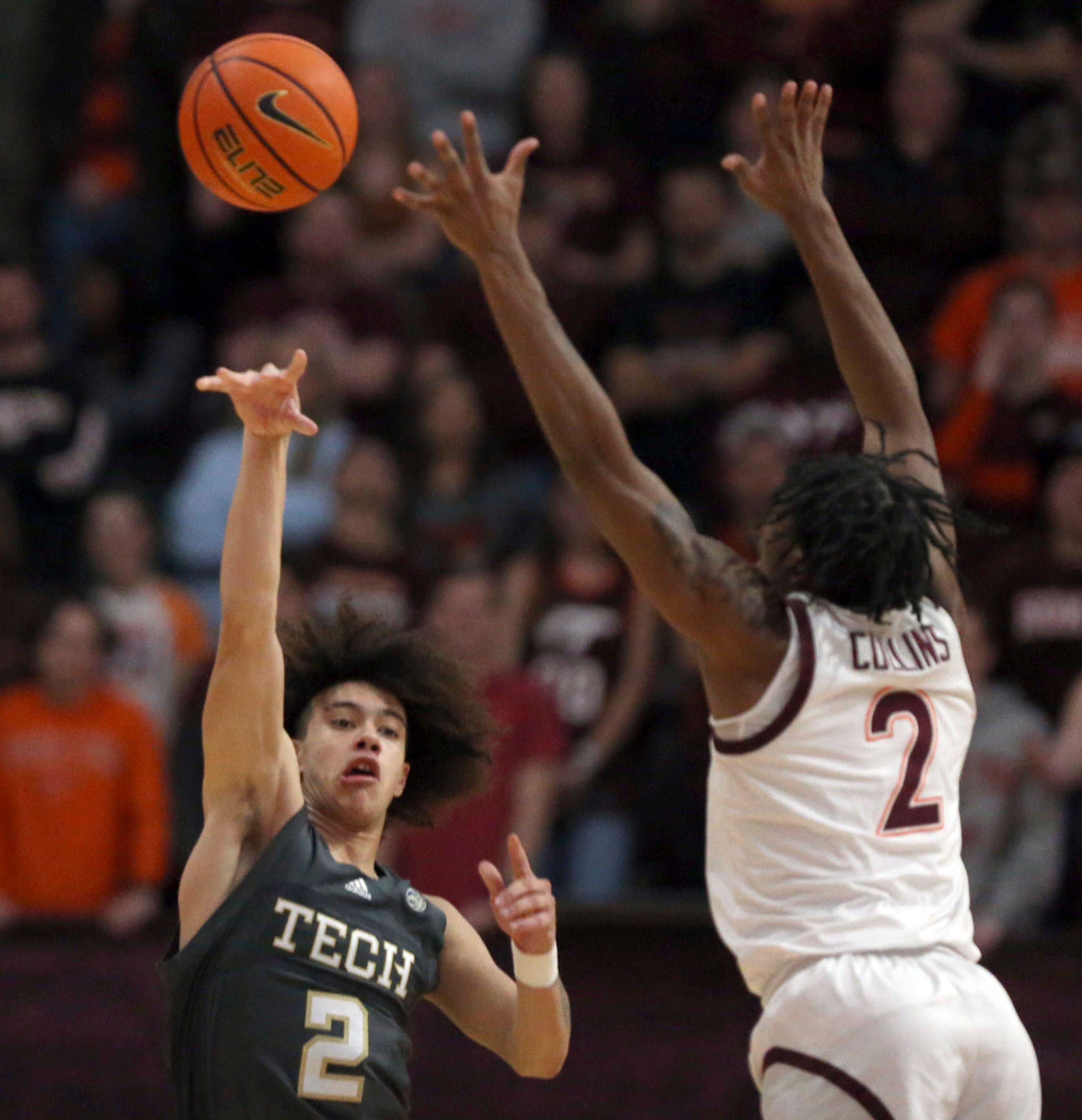 Georgia Tech's Naithan George (2) passes after getting a turnover from Virginia Tech's MJ Collins (2) in the first half of an NCAA college basketball game, Saturday, Jan. 27, 2024, in Blacksburg, Va. (Matt Gentry/The Roanoke Times via AP)