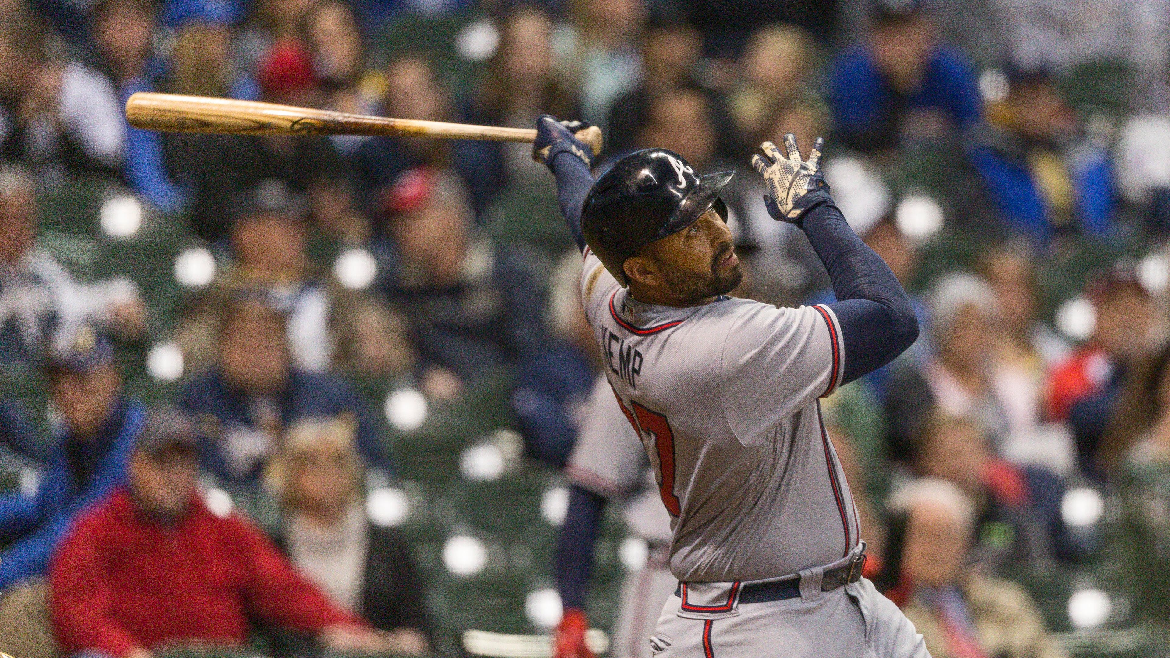 Braves’ Matt Kemp watches his third home run fly over the right field wall during the eighth inning Saturday. (AP Photo/Tom Lynn)