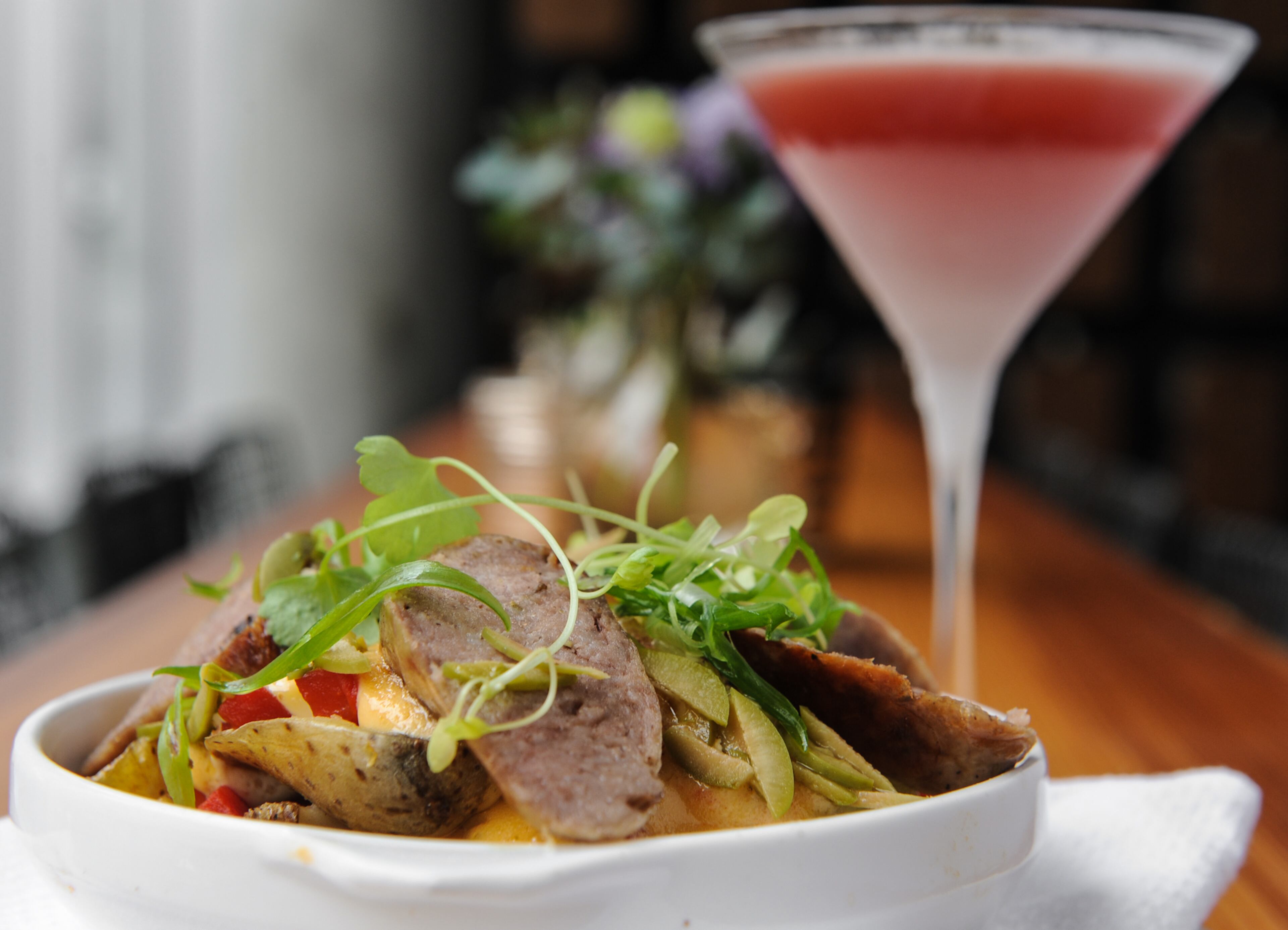 MARCH: Jon Watson wrote of Grain in Midtown, "If you bring more of an appetite with you, fear not. You still should leave full and happy." Read the full review here. Pictured: Fennel Sausage - baby fingerling potatoes, cerignola olives, calabrian chili rouille, roasted red peppers. Madam Ester- four roses bourbon, cayenne, red wine, lemon.(www.Beckysteinphotography.com)