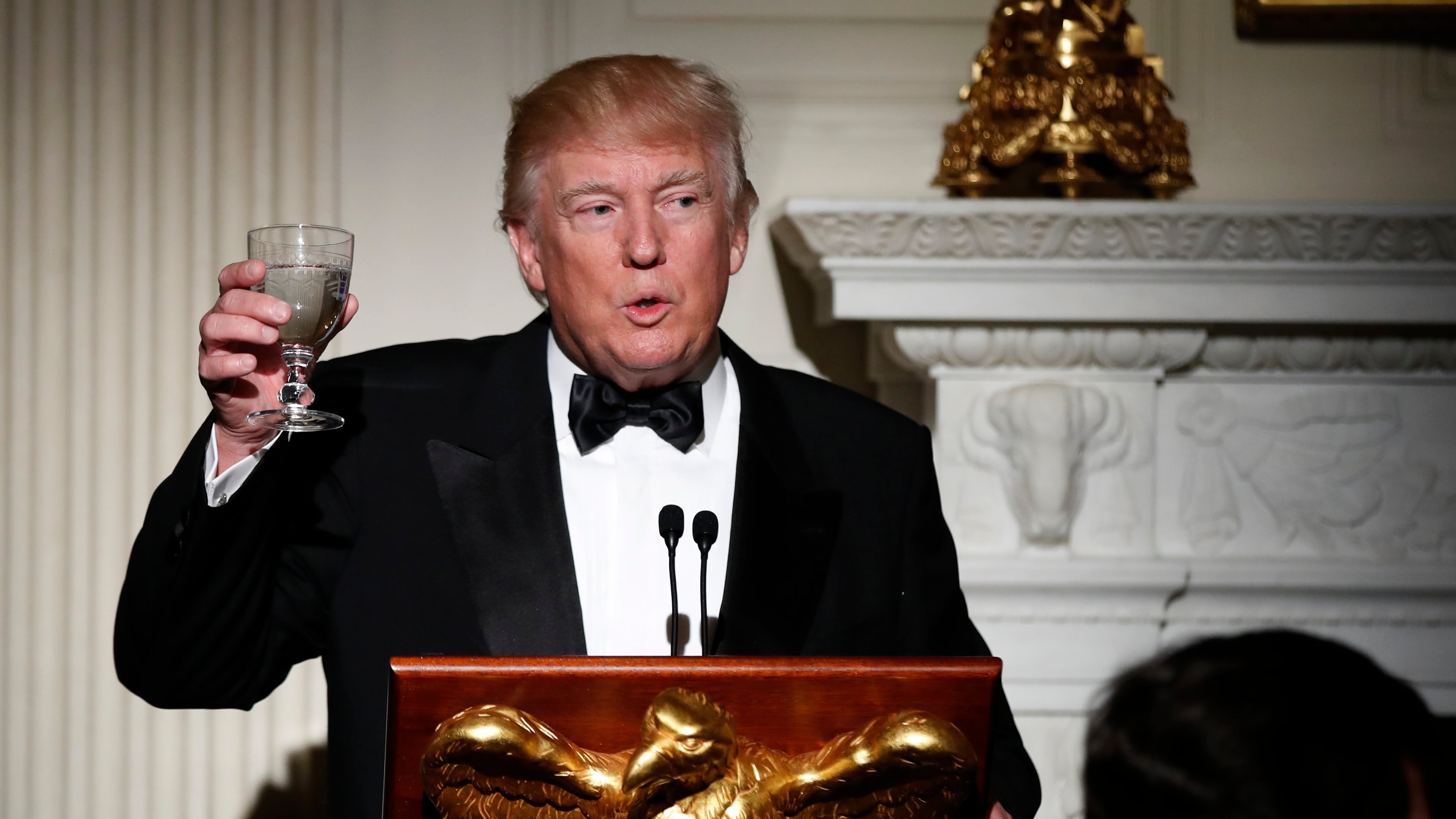 Host President Donald Trump, makes a toast during a dinner reception for the annual National Governors Association winter meeting Sunday, Feb. 26, 2017, at the State Dining Room of the White House, in Washington. (AP Photo/Manuel Balce Ceneta)