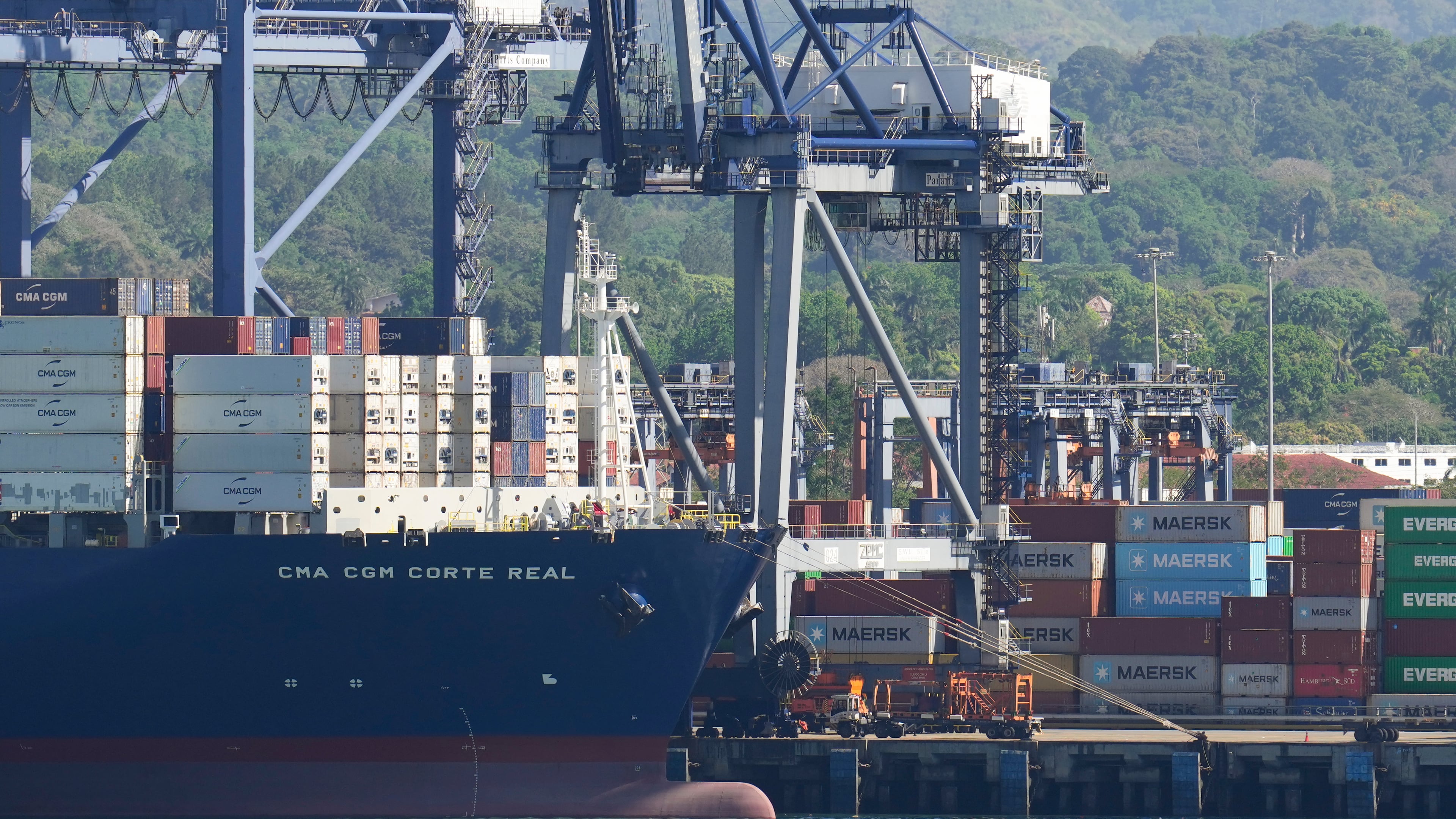 FILE - Cranes load a cargo ship at Panama Canal's Port of Balboa, managed by CK Hutchison Holdings, in Panama City, on Jan. 30, 2026. (AP Photo/Matias Delacroix, File)