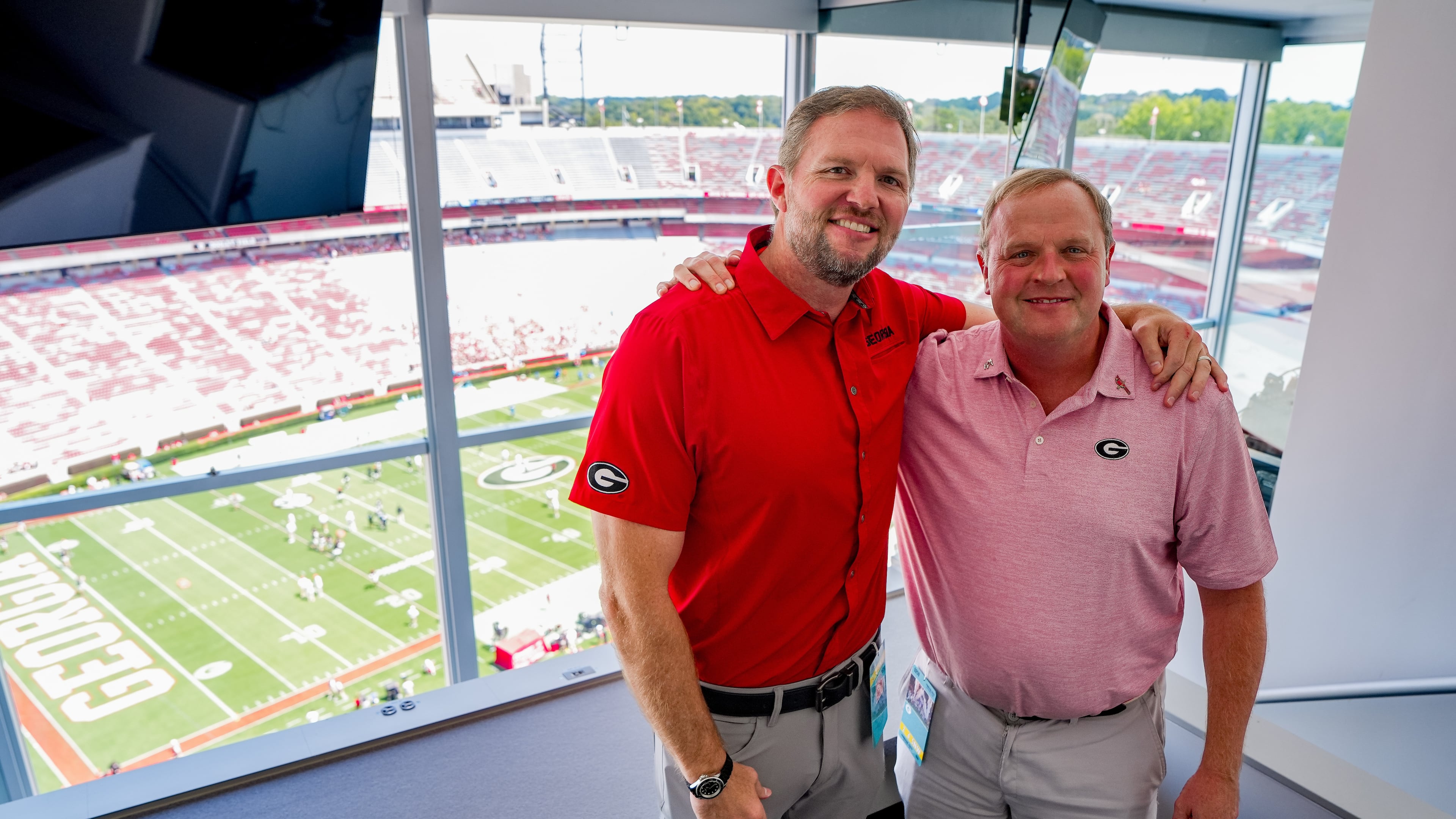 New Georgia Bulldogs radio play-by-play voice Jeff Dantzler (right) poses with Bulldogs football great and radio analyst Jon Stinchcomb before the season opener against Tennessee State at Sanford Stadium Sept. 5, 2026. (Tony Walsh/UGAAA)