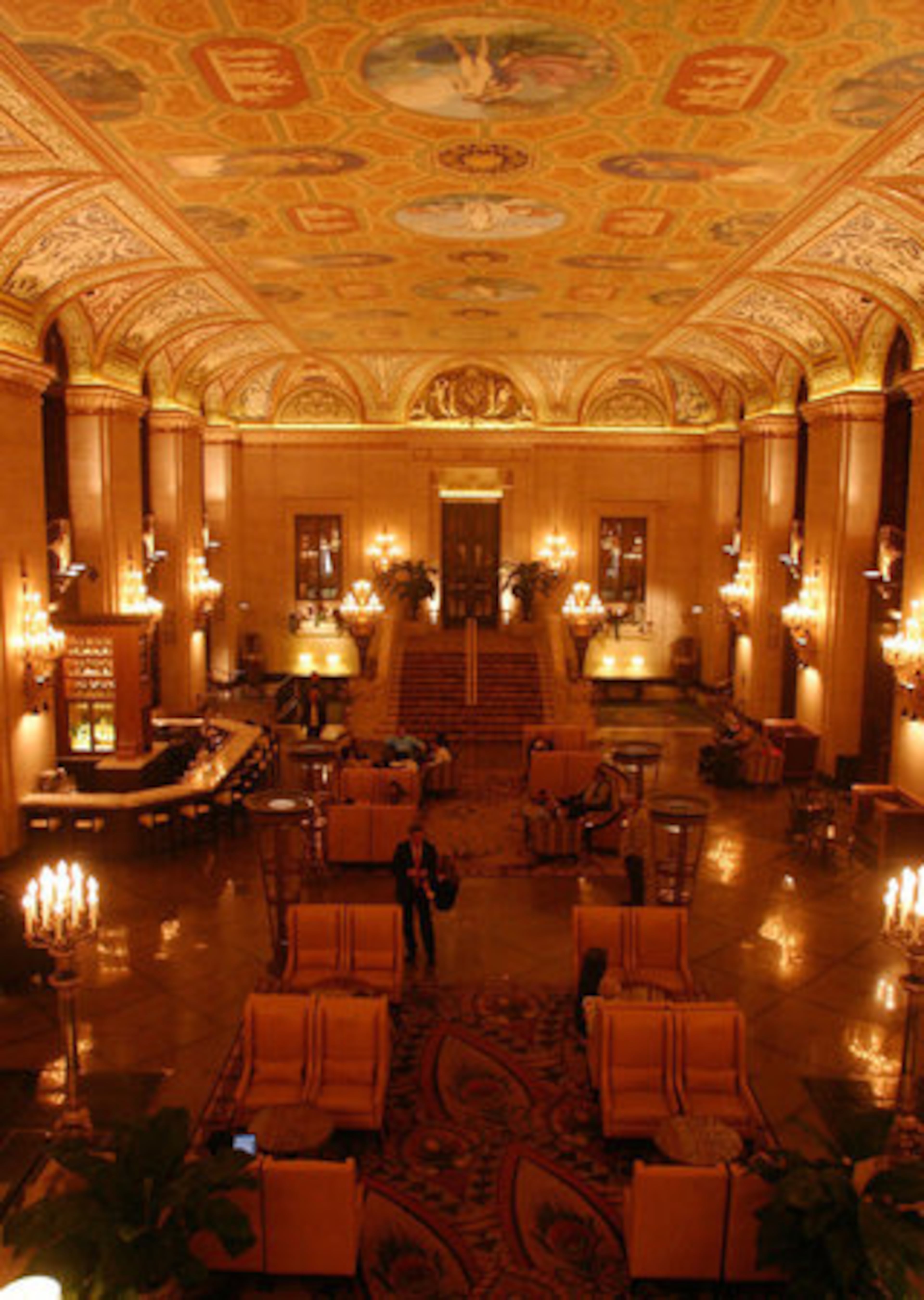 The beaux art lobby of the Palmer House Hilton is topped by a ceiling created by French muralist Louis Pierre Rigal.