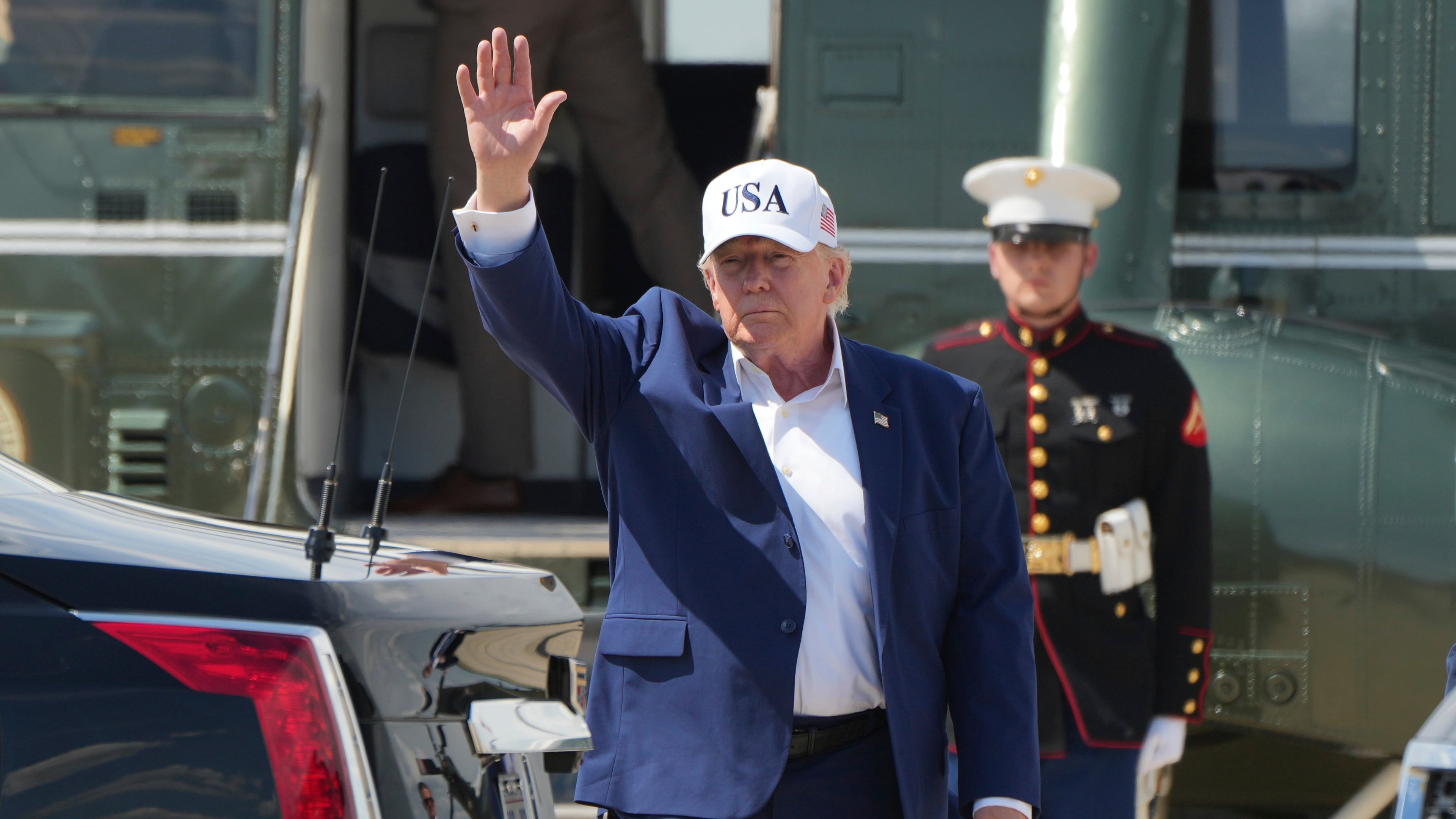 President Donald Trump waves as he arrives on Marine One at Joint Base Andrews, Md., Sunday, June 21, 2026, following a trip to Camp David. (AP Photo/Mark Schiefelbein)