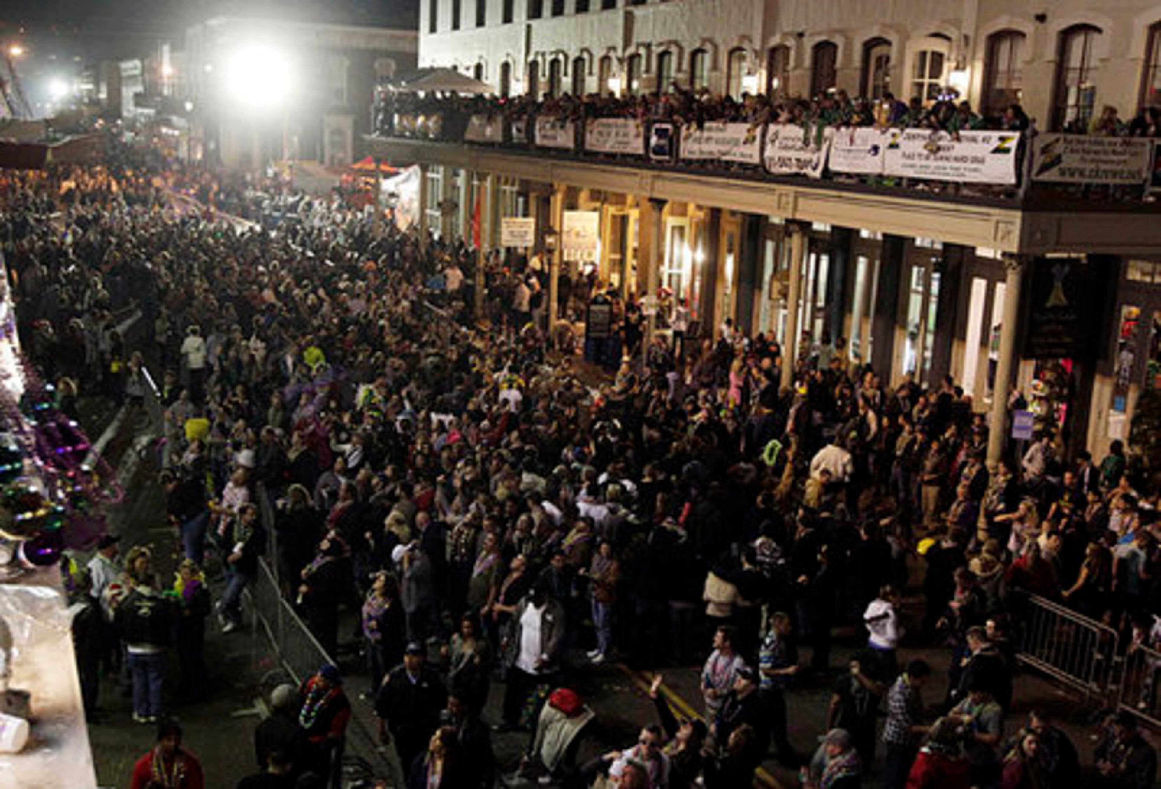 A large crowd fills The Strand after the Knights of Momus Grand Night Parade at Mardi Gras in Galveston on Saturday night Feb. 18, 2012.
