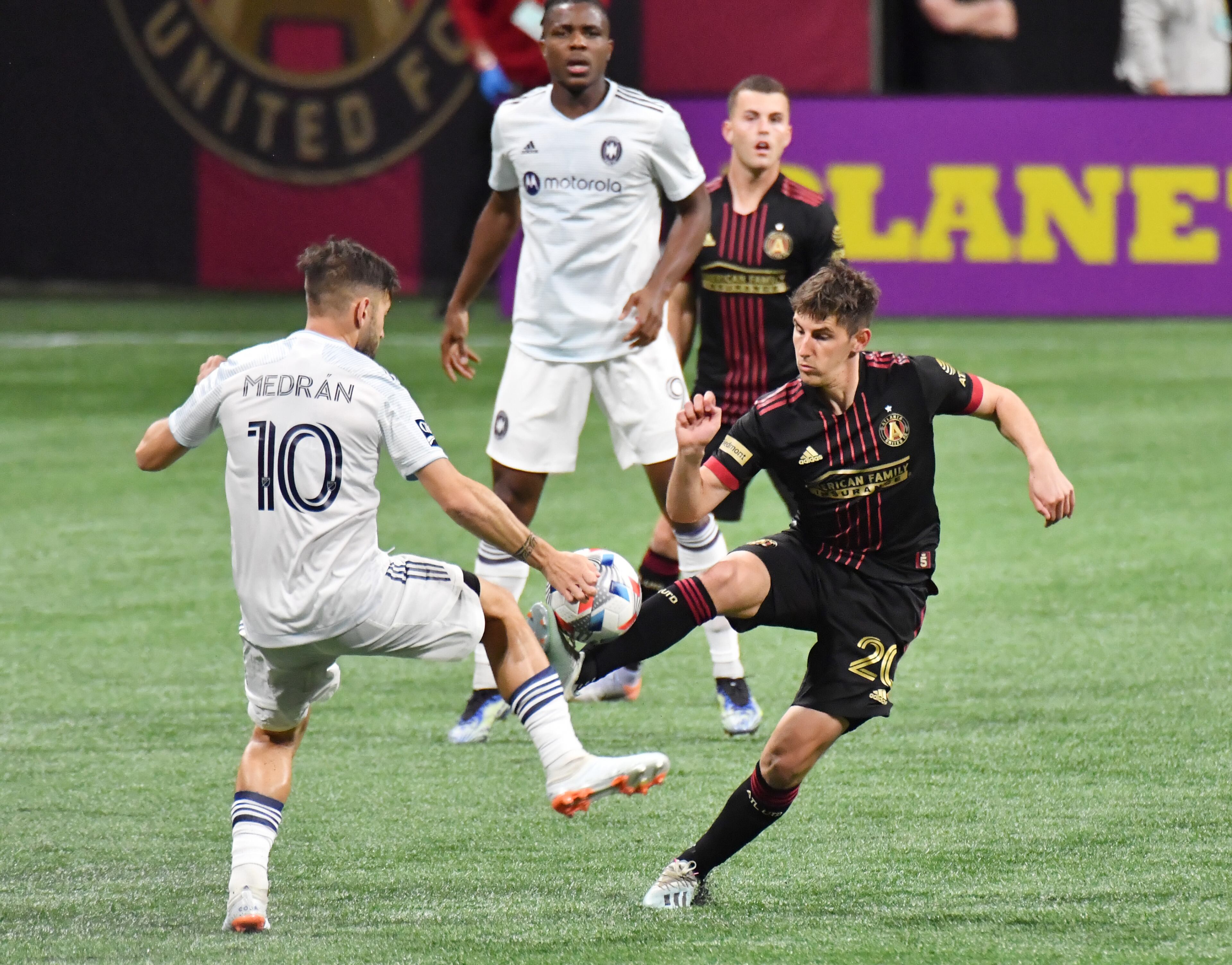 Atlanta United's midfielder Emerson Hyndman (20) battles Chicago Fire's midfielder Alvaro Medran (10) for the ball during the first half in an MLS soccer match at Mercedes-Benz Stadium in Atlanta on Saturday, April 24, 2021. (Hyosub Shin / Hyosub.Shin@ajc.com)