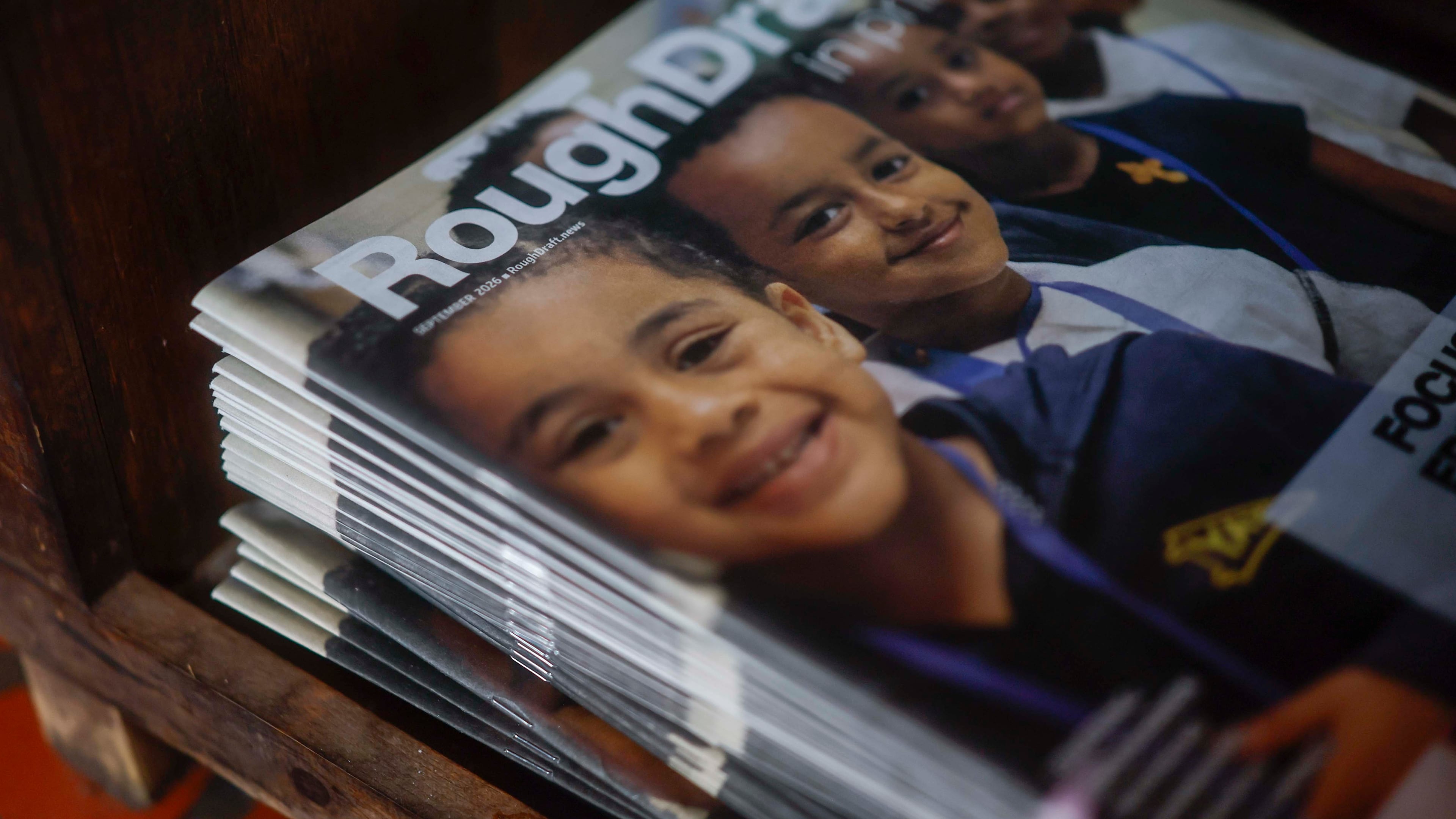 A stack of the latest print edition of Rough Draft is visible inside Manuel’s Tavern on Thursday, October 1, 2026. With a circulation of 70,500 copies across five Atlanta communities, Rough Draft is also launching a print edition in Athens. (Miguel Martinez/AJC)