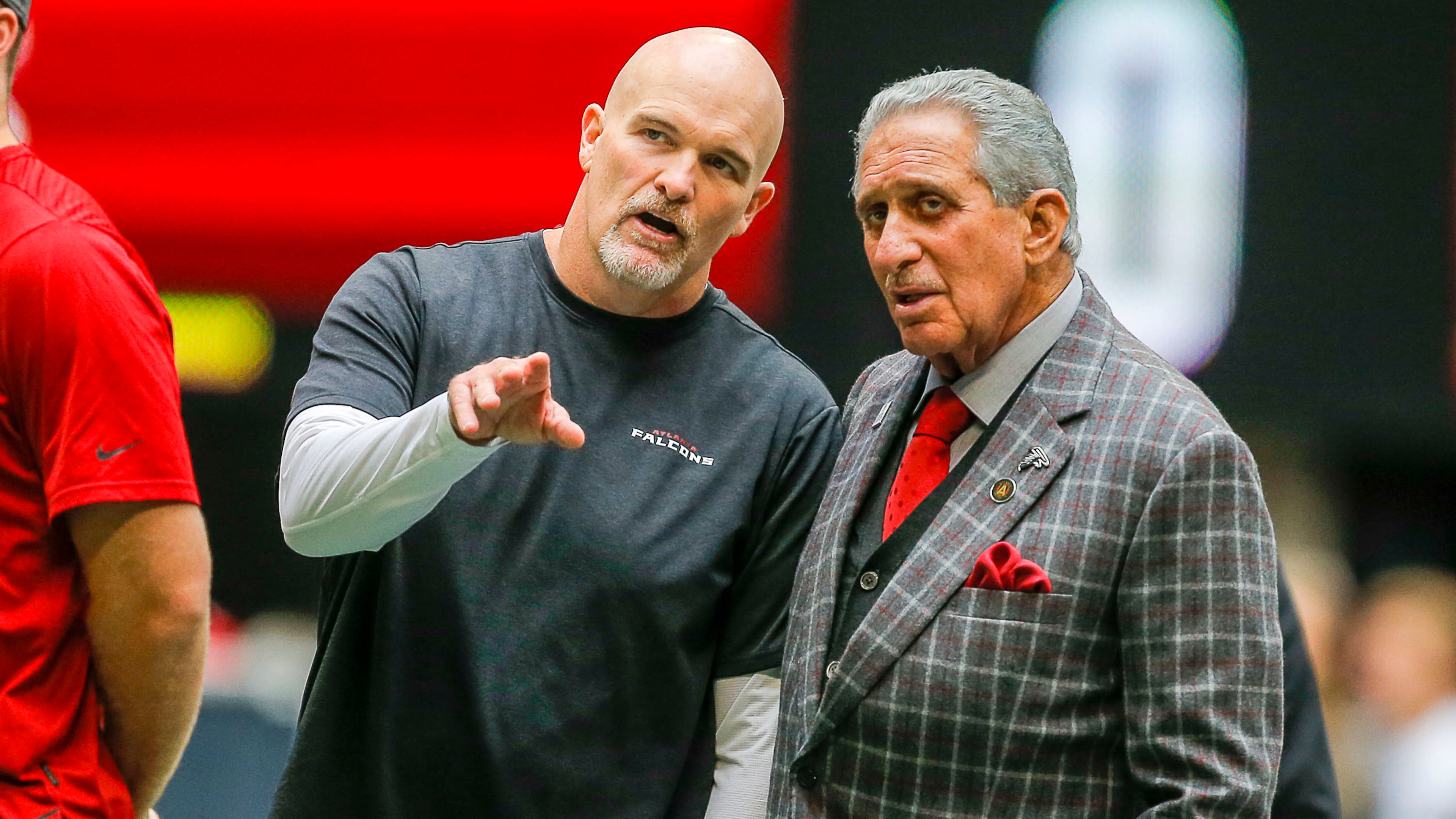 Atlanta Falcons head coach Dan Quinn and owner Arthur Blank watch the team warm up before they take on the Los Angeles Rams Sunday, Oct. 20, 2019, at Mercedes-Benz Stadium in Atlanta.