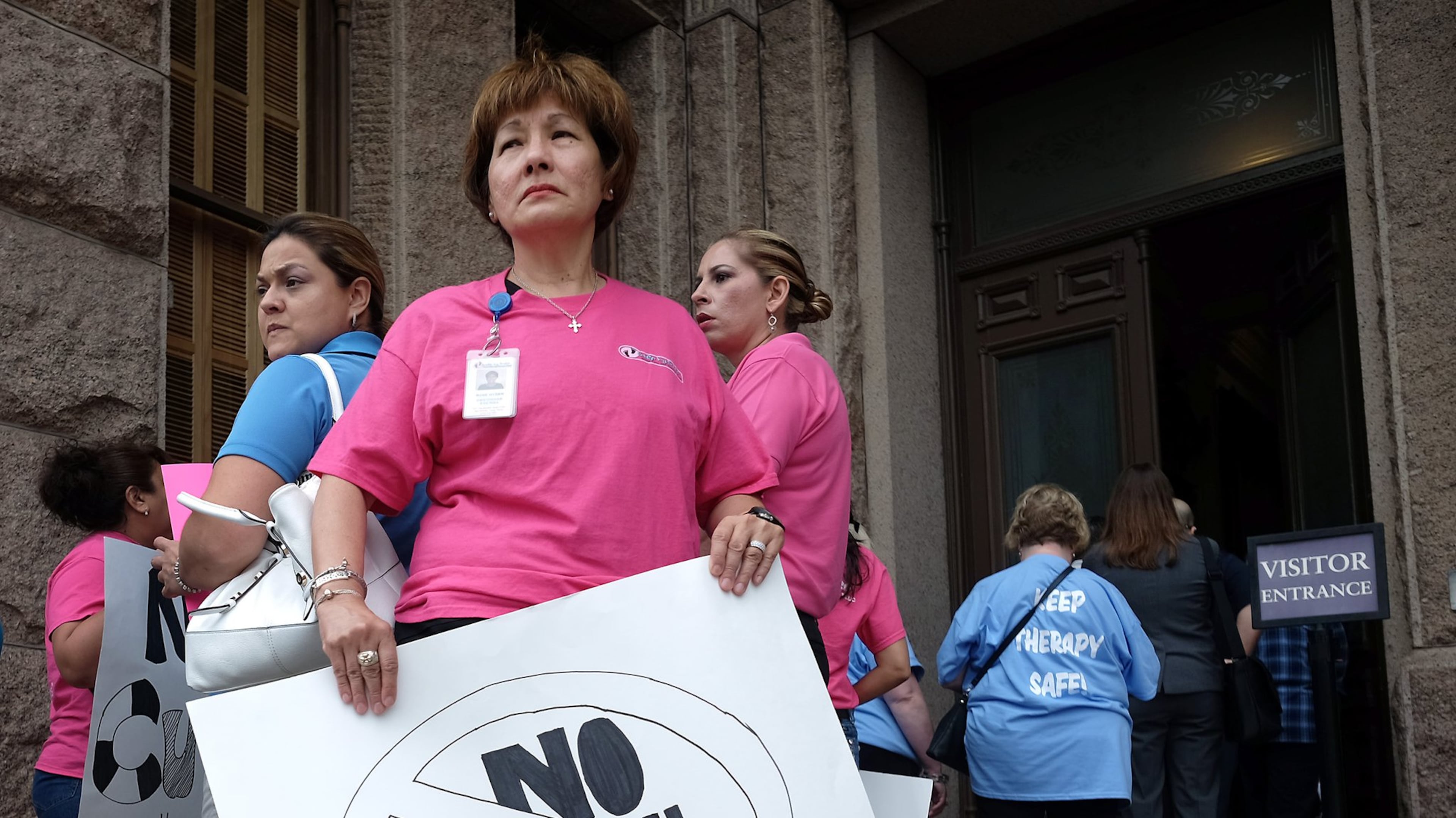 Opponents of proposed budget cut in therapy services from the Medicaid program for children with disabilities and the elderly waited in line to speak with Texas lawmakers. (File)