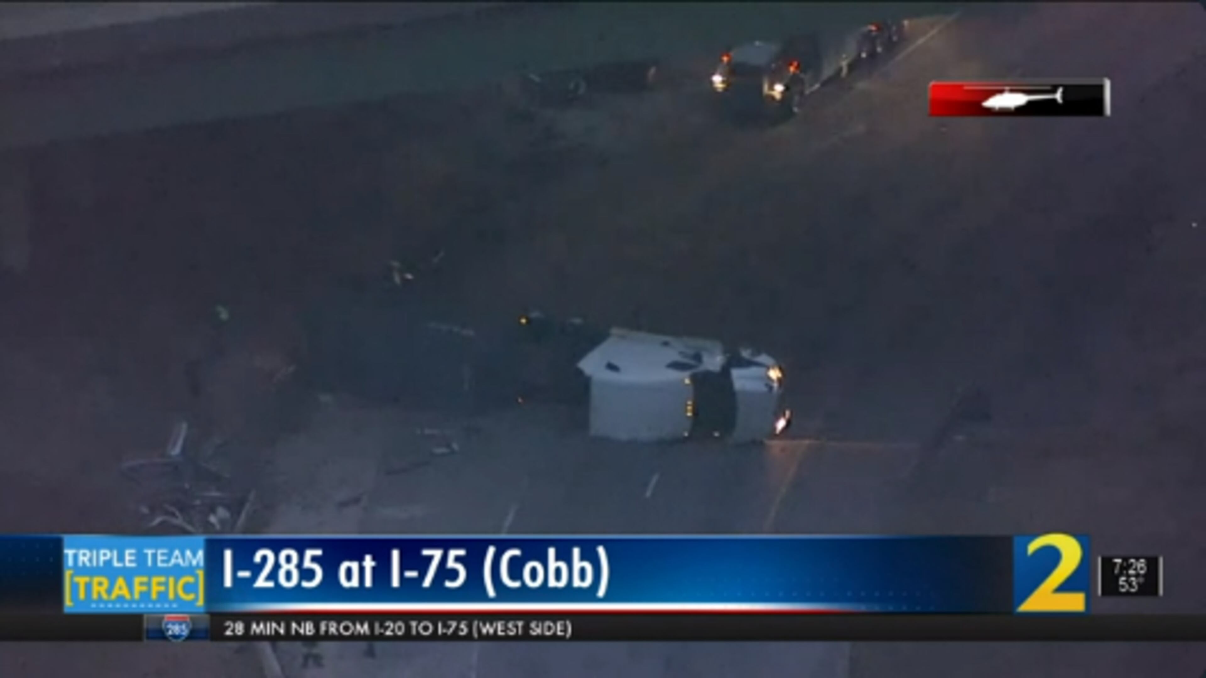 The northbound ramp to I-75 from I-285 East was blocked Wednesday morning after a tractor-trailer overturned.