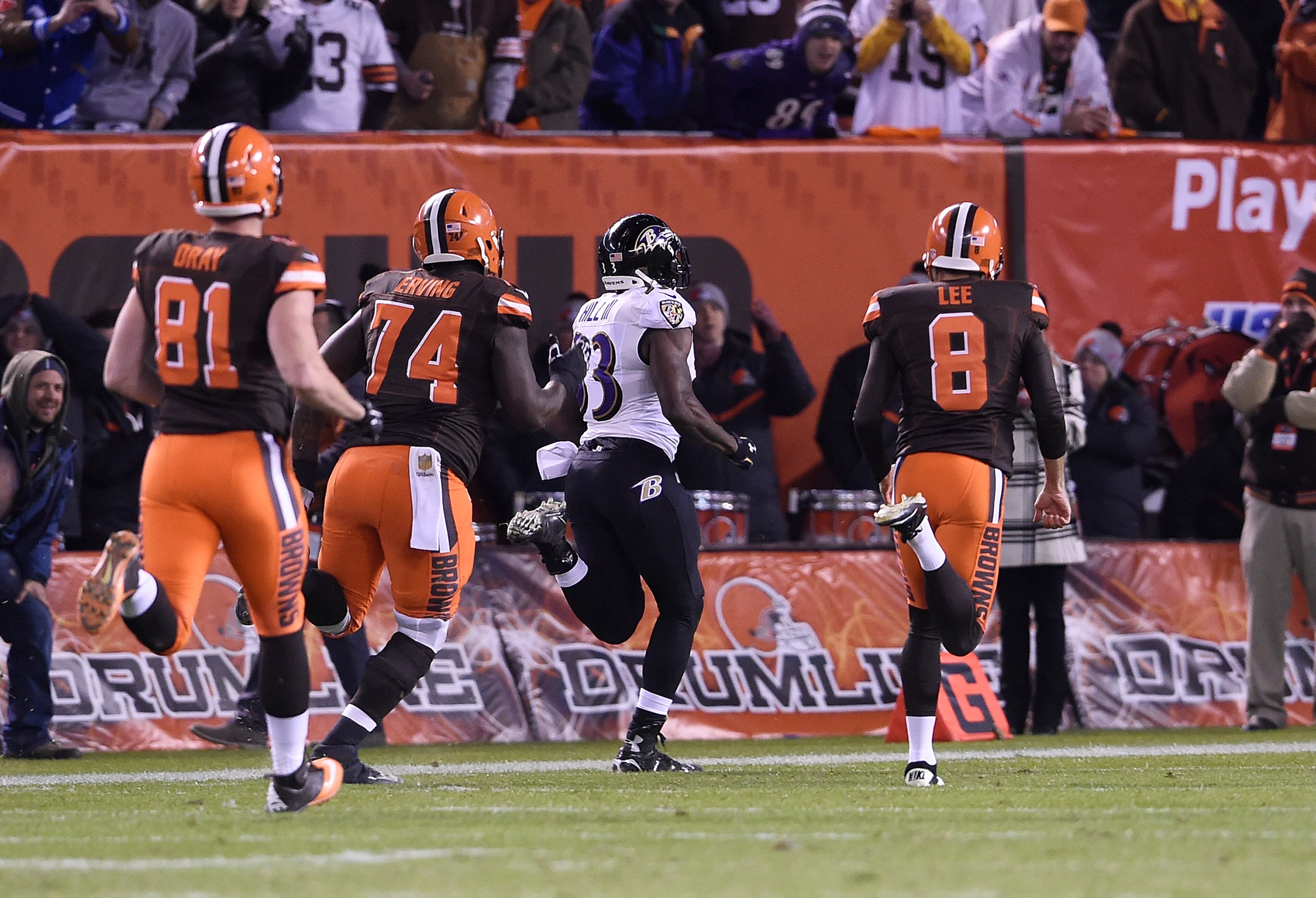 CLEVELAND, OH - NOVEMBER 30: Will Hill #33 of the Baltimore Ravens returns a blocked field goal for a touchdown in front of Jim Dray #81, Cameron Erving #74 and Andy Lee #8 of the Cleveland Browns during the fourth quarter at FirstEnergy Stadium on November 30, 2015 in Cleveland, Ohio. Baltimore won the game 33-27. (Photo by Jason Miller/Getty Images)