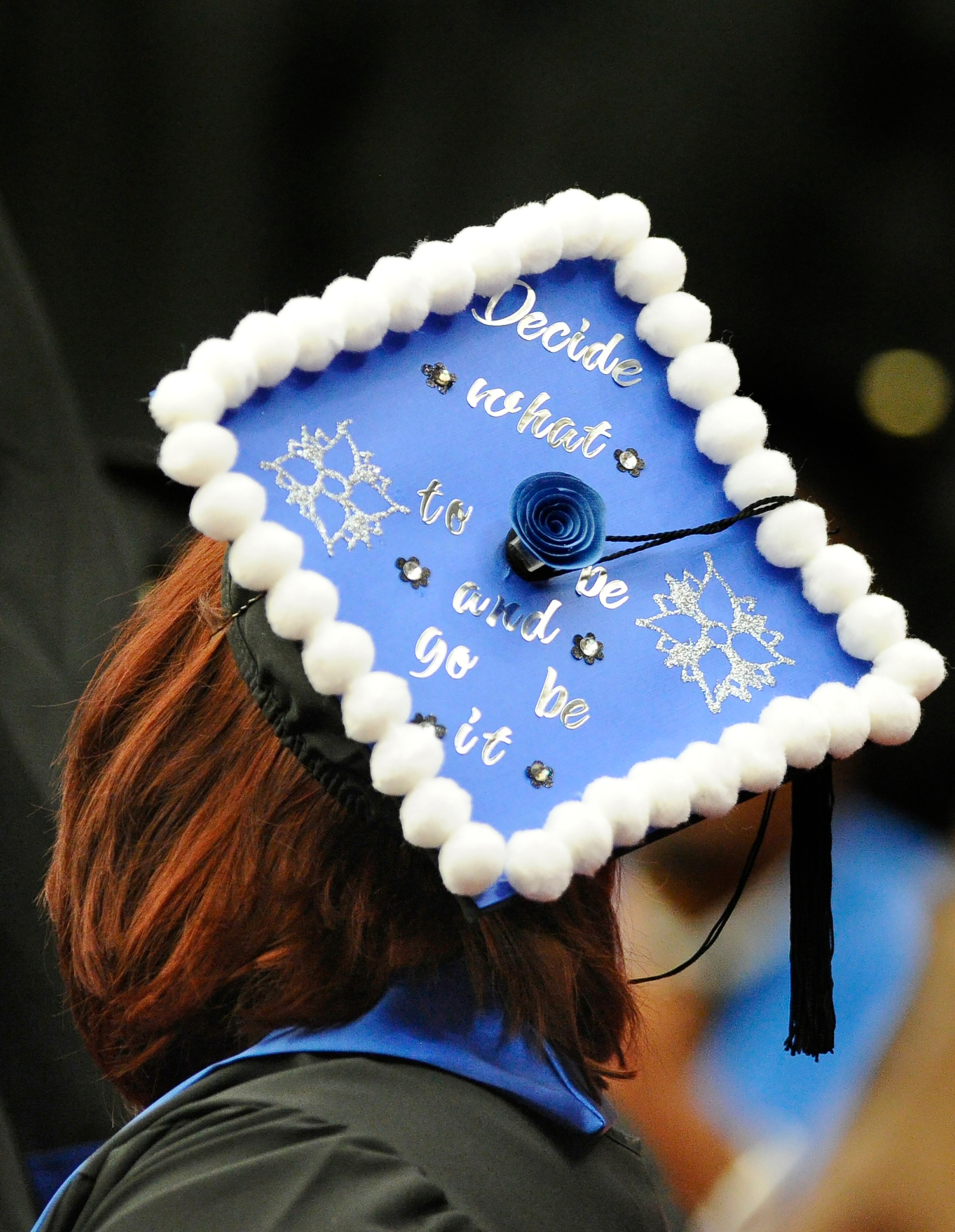 A Georgia State University student has a message for family members and friends during the college's graduation ceremony at the Georgia Dome on Saturday, May 9, 2015, in Atlanta. David Tulis / AJC Special