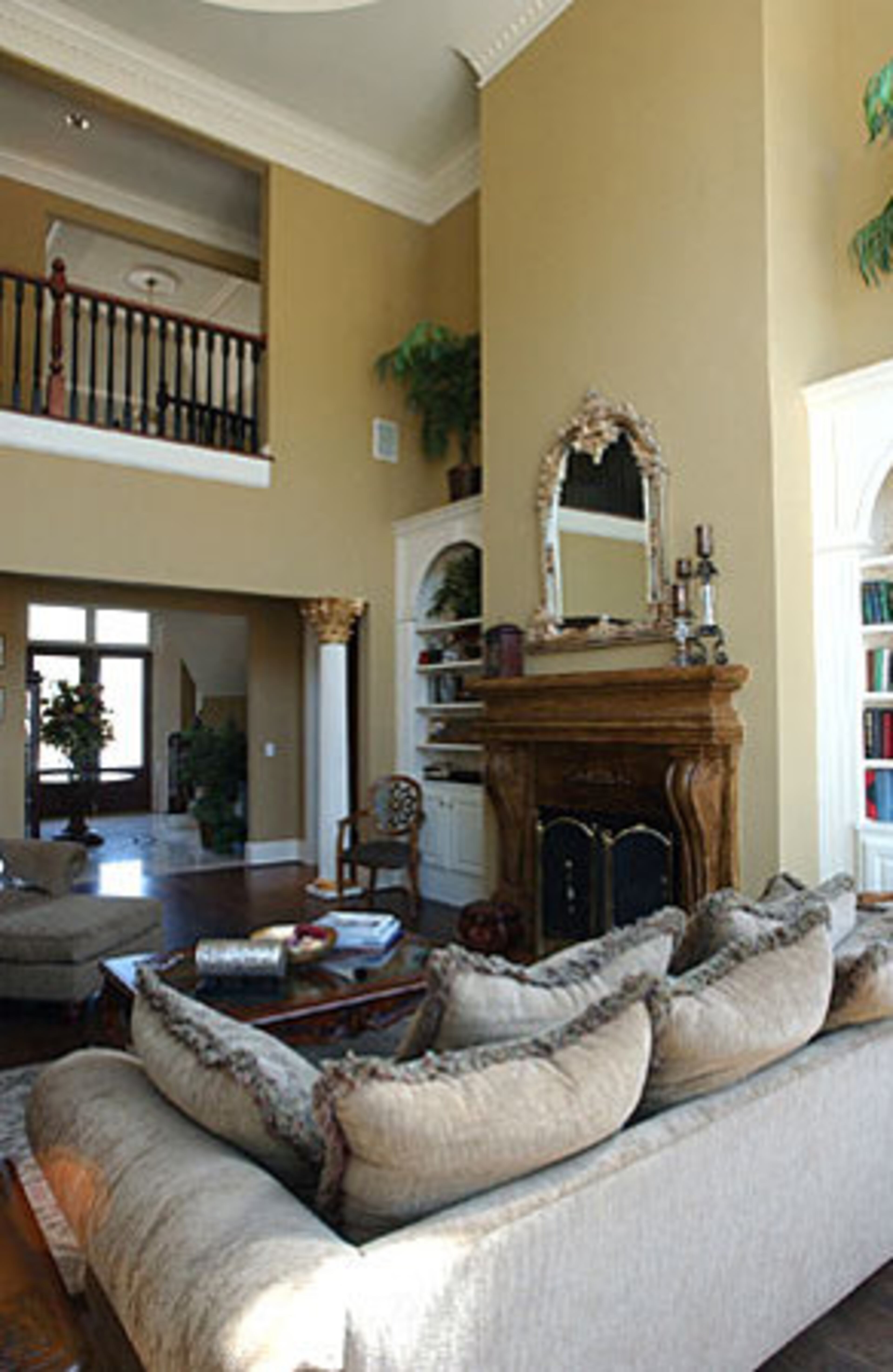 The great room features built-in bookcases and arched windows for abundant light. Taylor and her first husband built the five-bedroom, five-and-a-half bath home "as an investment" for $960,000 in 1999.