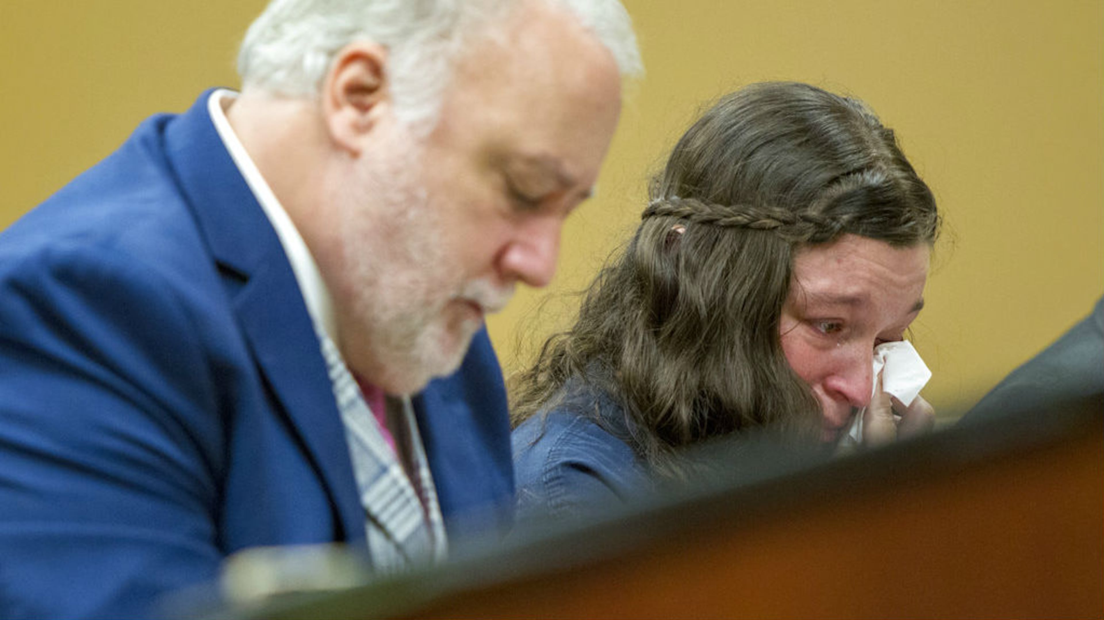 Tatiana Fusari reacts while listening to the 911 call her husband, Seth Welch, placed Aug. 2, 2018, after they found their 10-month-old daughter, Mary Anne Welch, dead in her crib at the family's Cedar Springs, Michigan, farm. Welch and Fusari, both 27, were in court in Grand Rapids Wednesday, Oct. 10, 2018, for their preliminary hearing on charges of felony murder and first-degree child abuse in Mary's death, which an autopsy determined was caused by malnutrition and dehydration due to neglect by her parents.