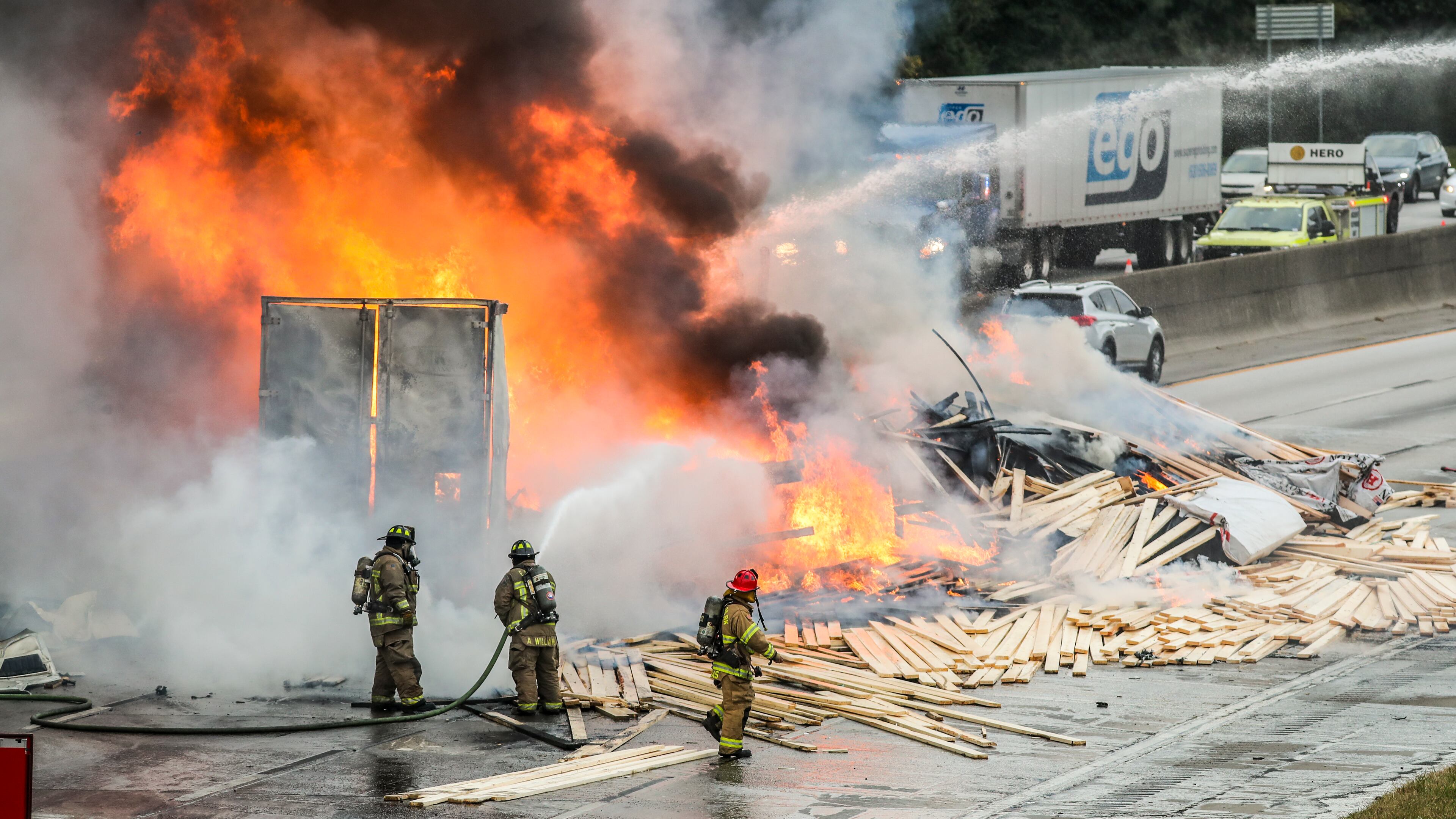 October 21, 2021 Fulton County: In the kind of calamity only possible in metro Atlanta traffic, two trucks carrying loads of lumber and candles collided on I-285 and burst into flames Thursday, Oct. 21, 2021. (John Spink / John.Spink@ajc.com)
