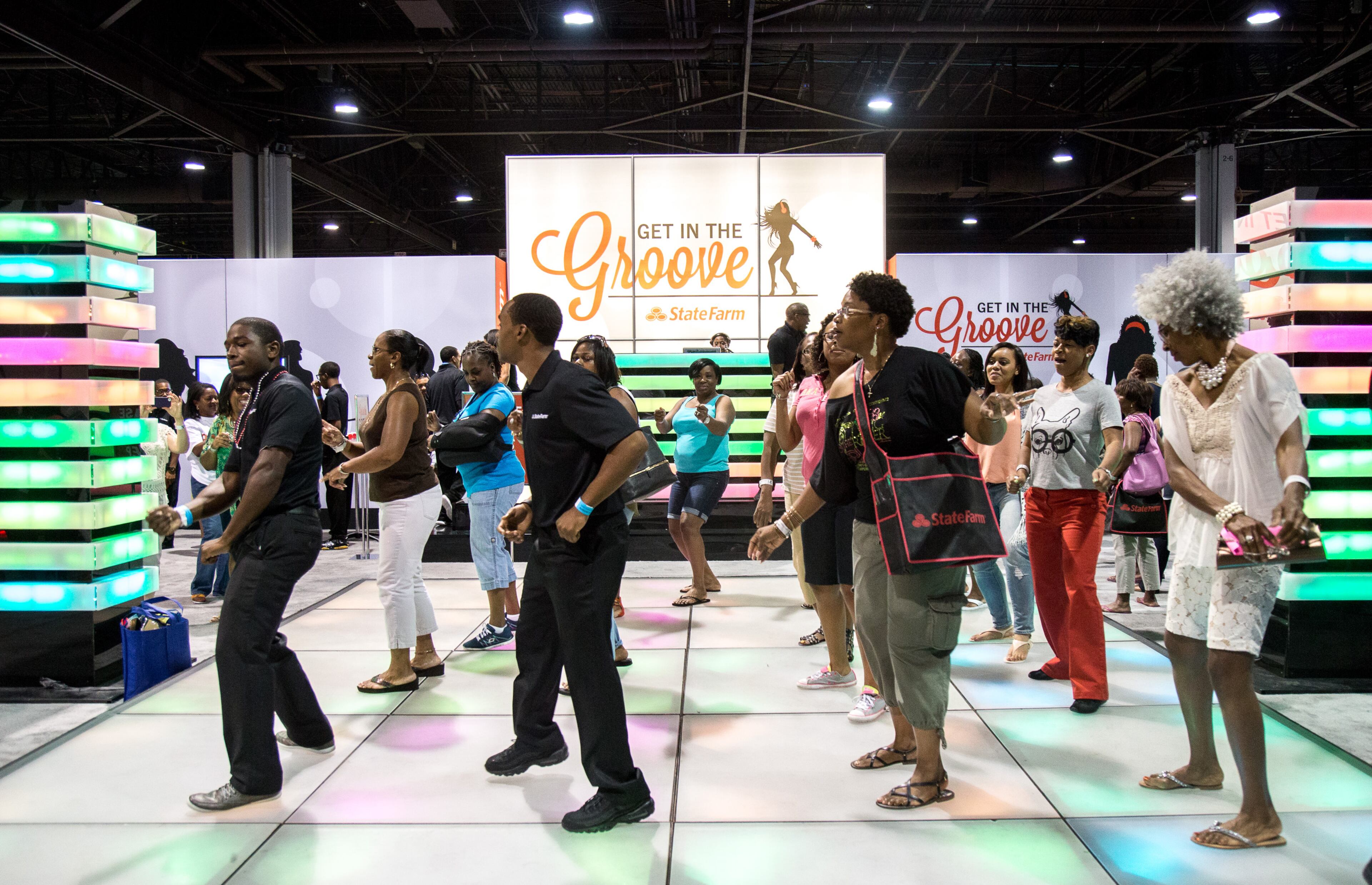 People crowd a dance floor at the World Congress Center exhibit hall, during the State Farm Neighborhood Awards Expo, in Atlanta Georgia Saturday, August 8, 2015. STEVE SCHAEFER / SPECIAL TO THE AJC