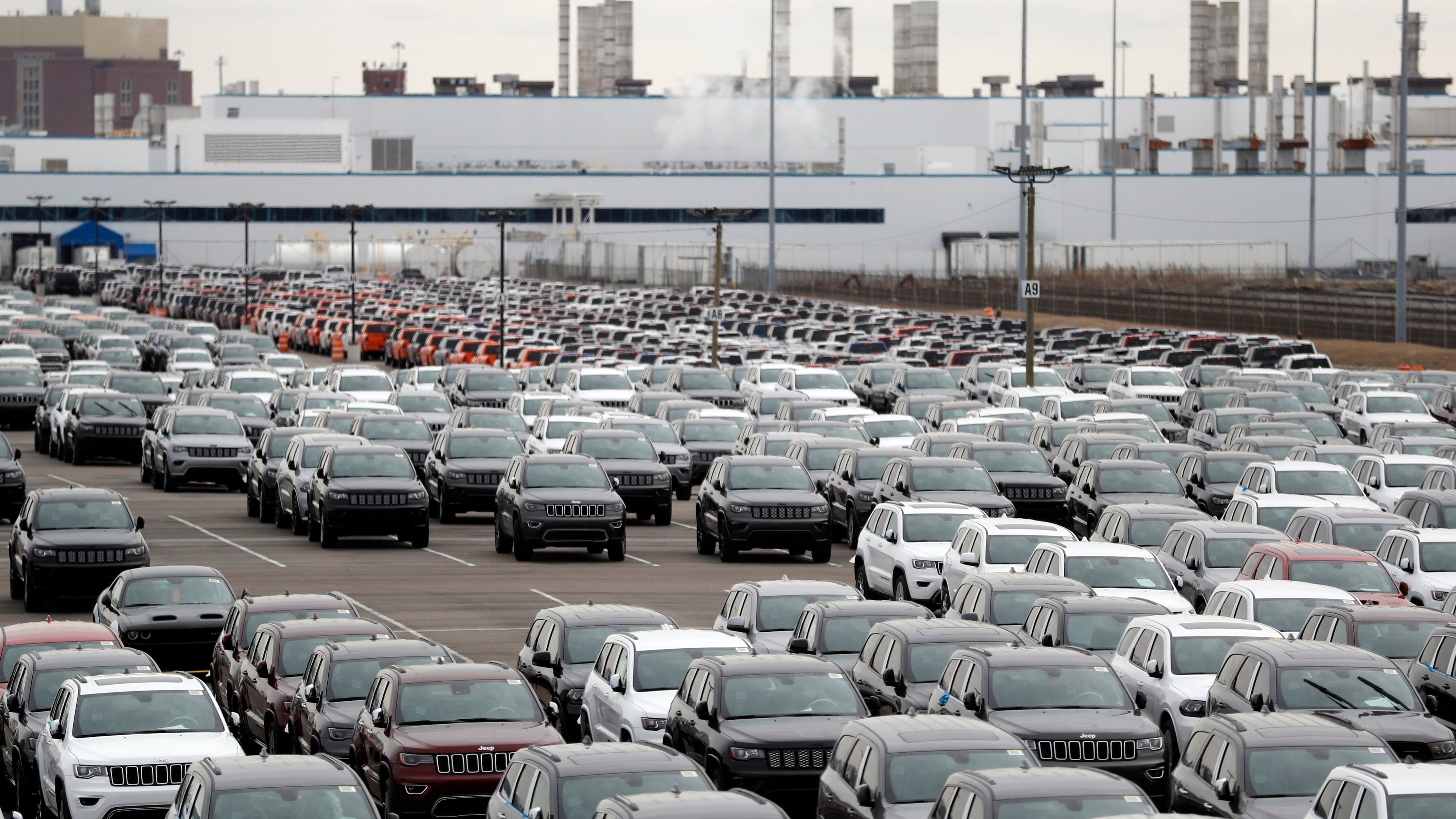 FILE - In this Feb. 26, 2019, file photo, Jeep vehicles are parked outside the Jefferson North Assembly Plant in Detroit. (AP Photo/Carlos Osorio, File)
