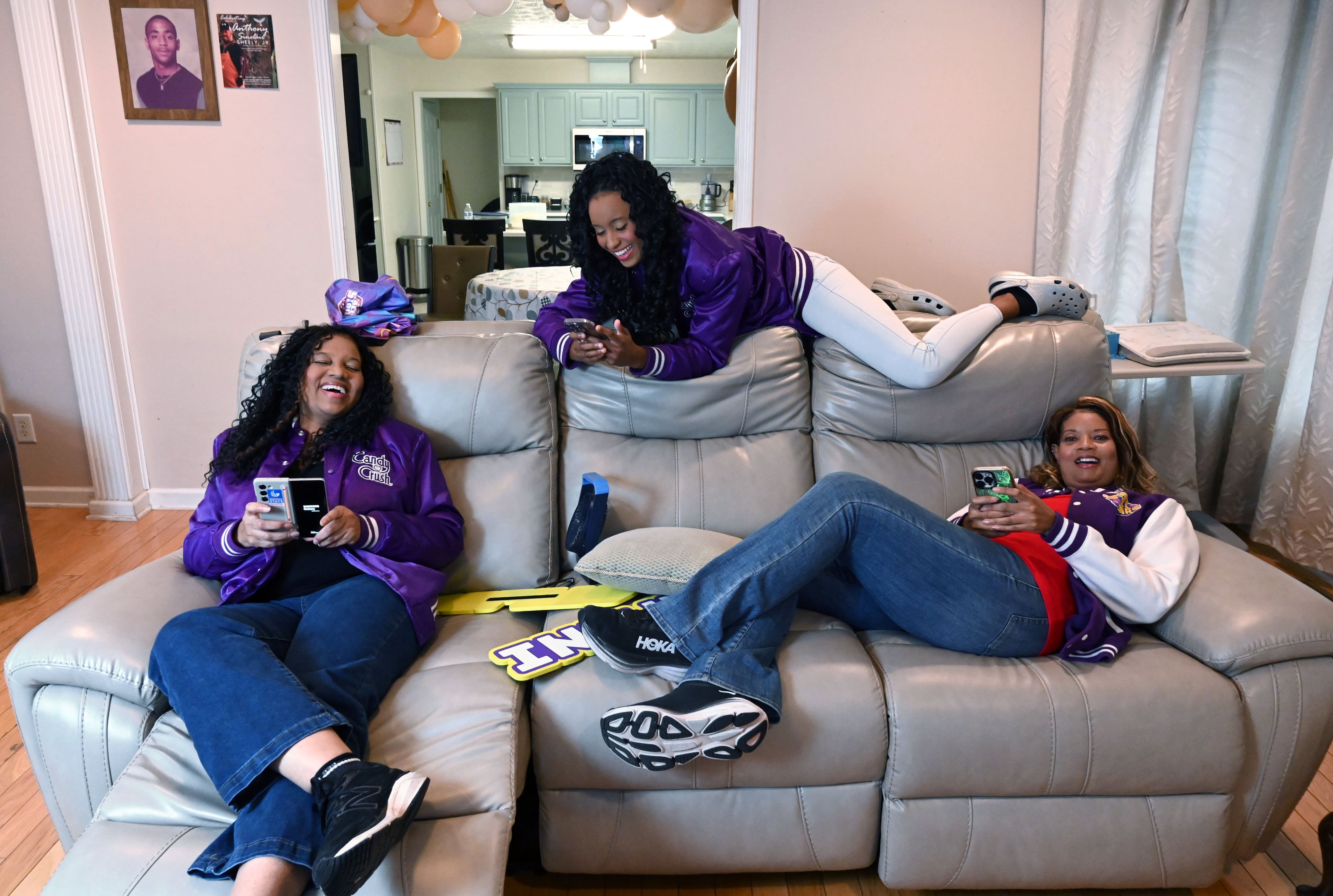 Selita Boyd (left), her sister Aalja Boyd (right) and her niece Jemini Powell (center) pose as they do when playing Candy Crush on Tuesday, Aug. 4, 2026, in Stone Mountain. Every year, there's a $1 million Candy Crush tournament in London where the top 10 players compete. The past two years, three family members from Stone Mountain had vied for that $1 million: Selita Boyd, her sister Aalja and her nice Jemini Powell. (Hyosub Shin/AJC)