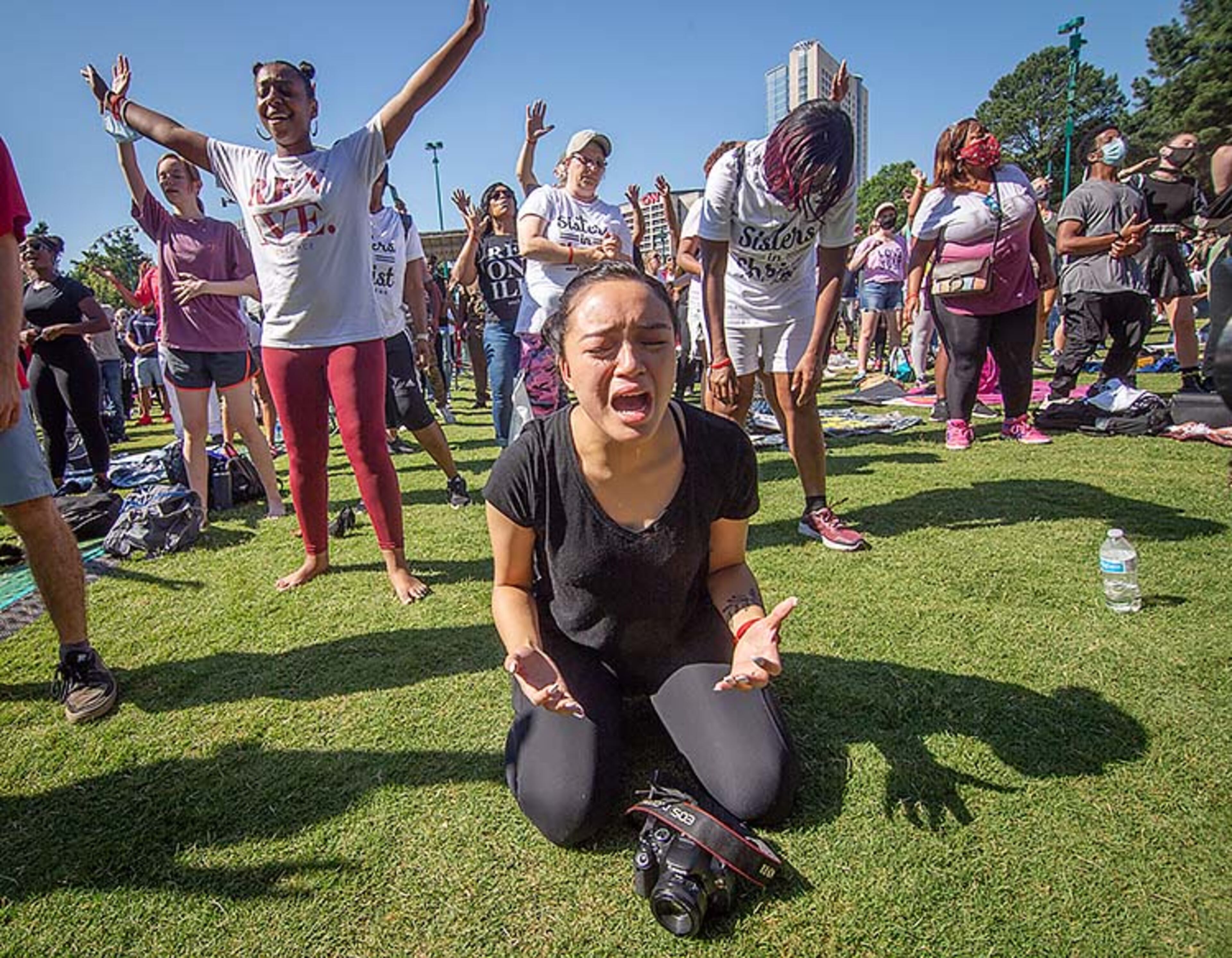 Erika Salenna, 21, participates in an OneRace prayer and worship at Centennial Olympic Park before marching to the State capital Friday, June 19, 2020. STEVE SCHAEFER FOR THE ATLANTA JOURNAL-CONSTITUTION