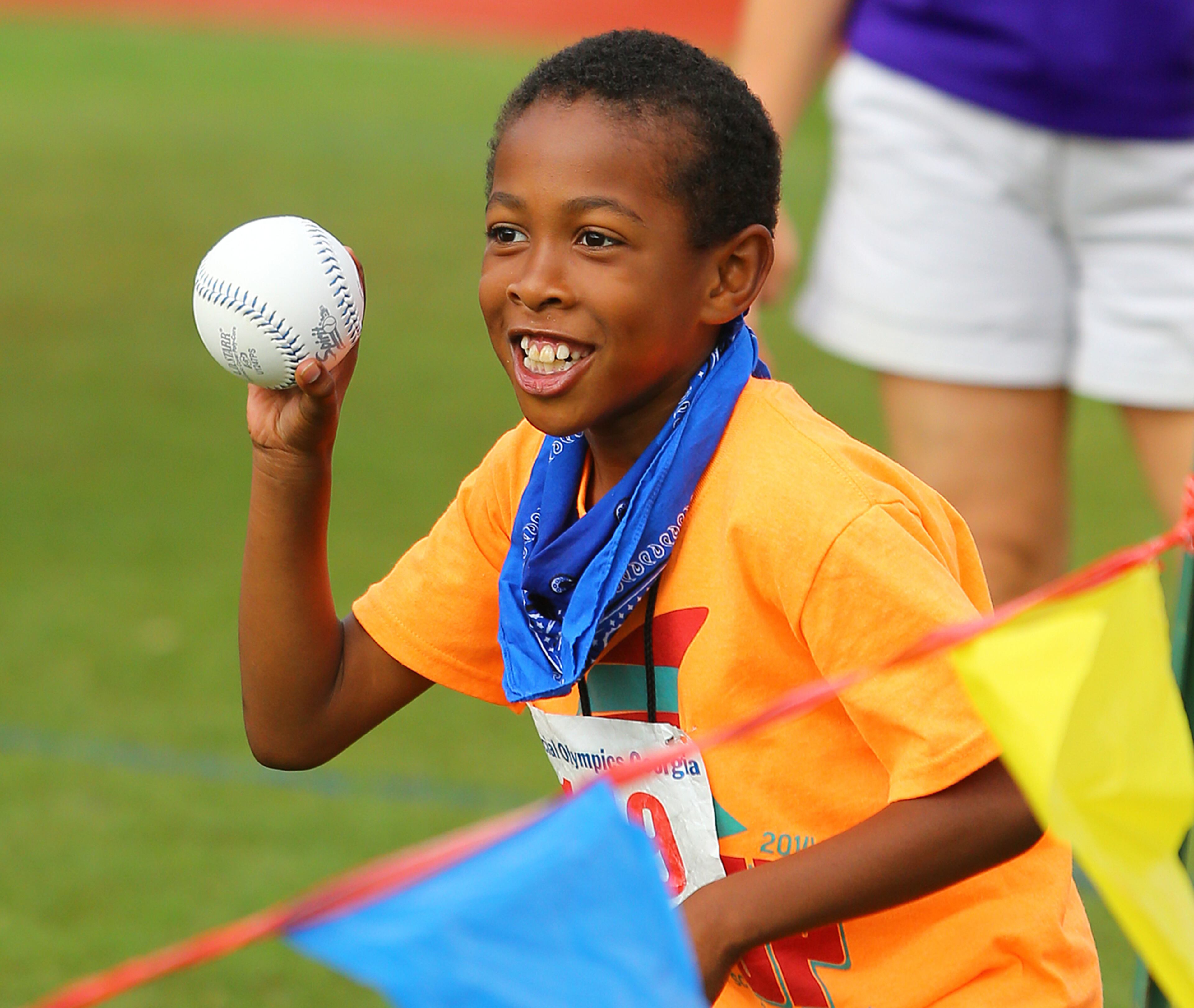 Jair Franklin, 9, Fulton County Schools, prepares to make his throw while competing in the softball throw during the Special Olympics Georgia State Summer Games at Emory University on Sunday, June 1, 2014, in Atlanta.
