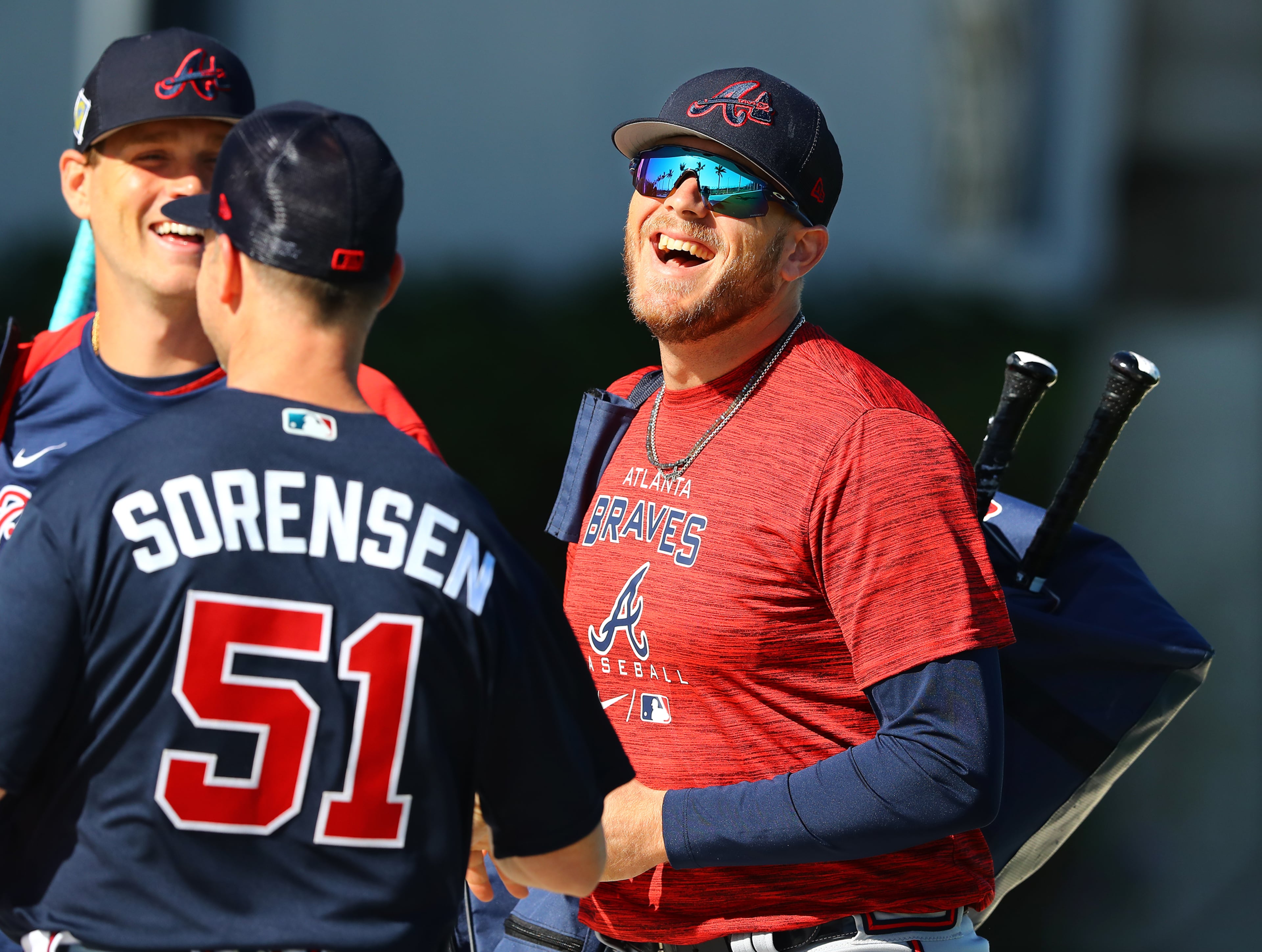 030622 North Port: Atlanta Braves minor league player Greyson Jenista shares a laugh with teammates as he arrives for the first day of Braves minor league spring training camp on Sunday, March 6, 2022, in North Port. “Curtis Compton / Curtis.Compton@ajc.com”`