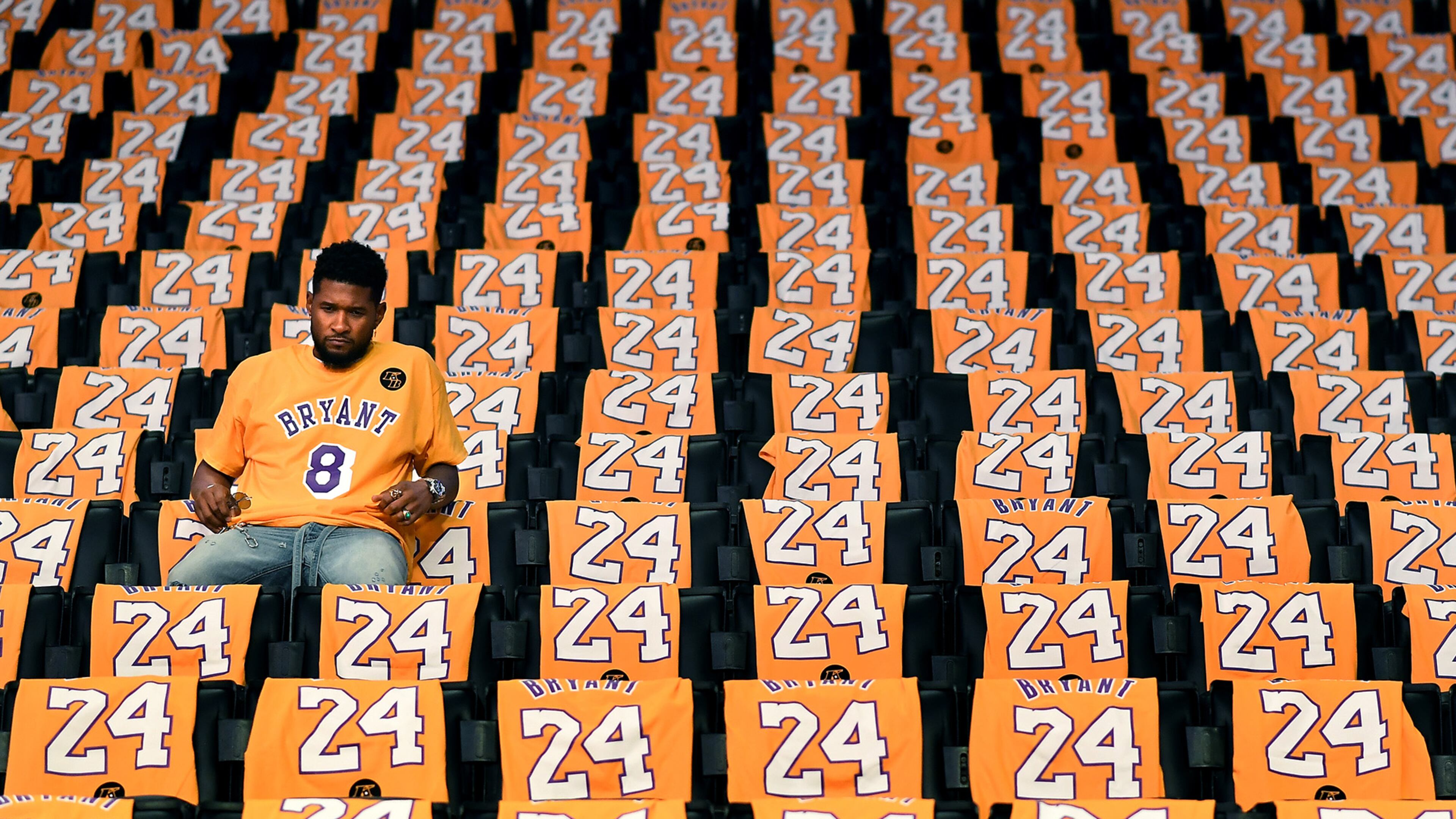 Usher sits alone in the stands at Staples Center before his performance in a ceremony honoring the recently deceased Lakers star before a game against the Portland Trailblazers in Los Angeles on Friday, Jan. 31, 2020. (Wally Skalij/Los Angeles Times/TNS)