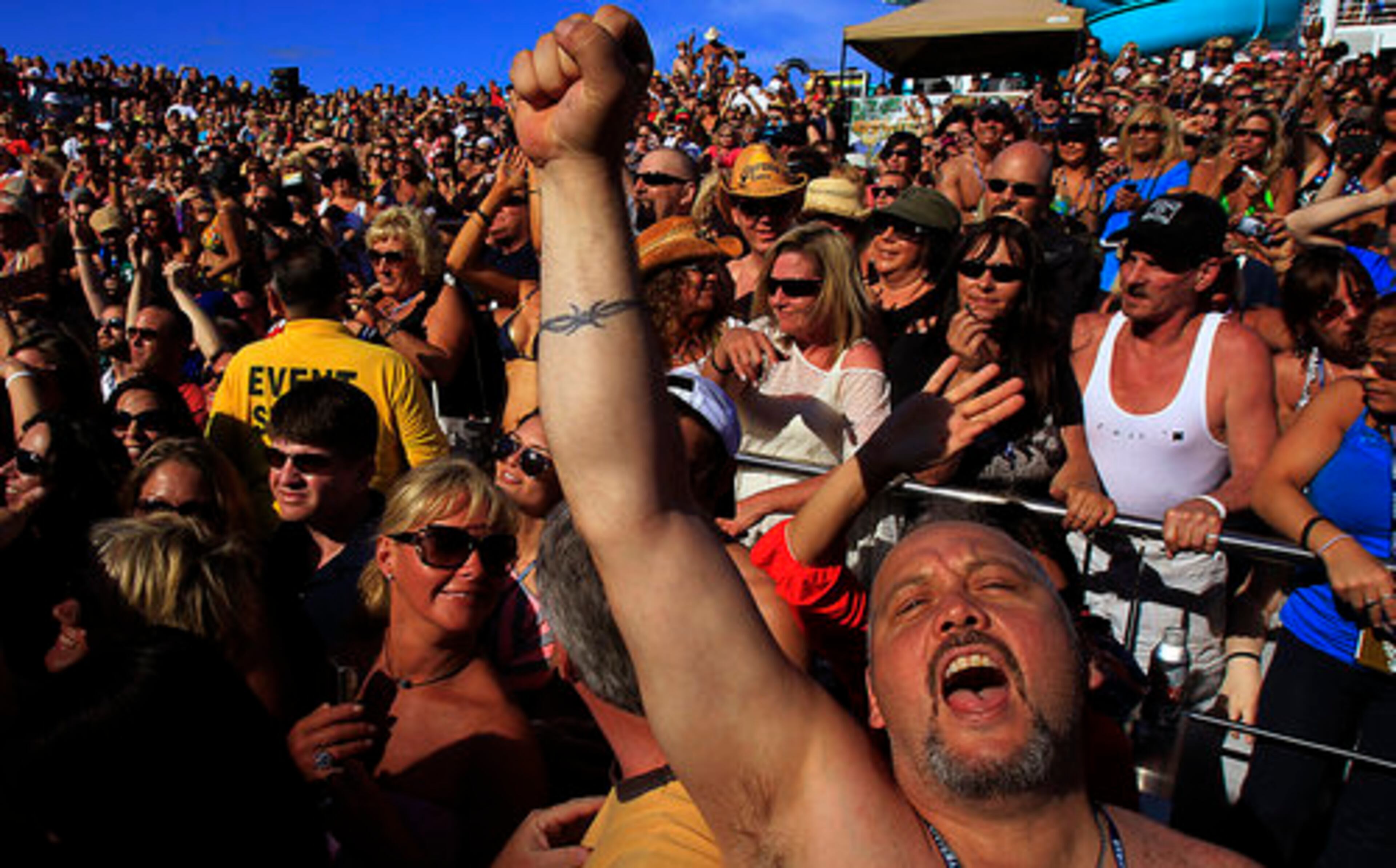 Fans jam to one of the cruise's featured concerts by 12 performers, including shows from Yelawolf, Uncle Kracker and Roger Alan Wade.
