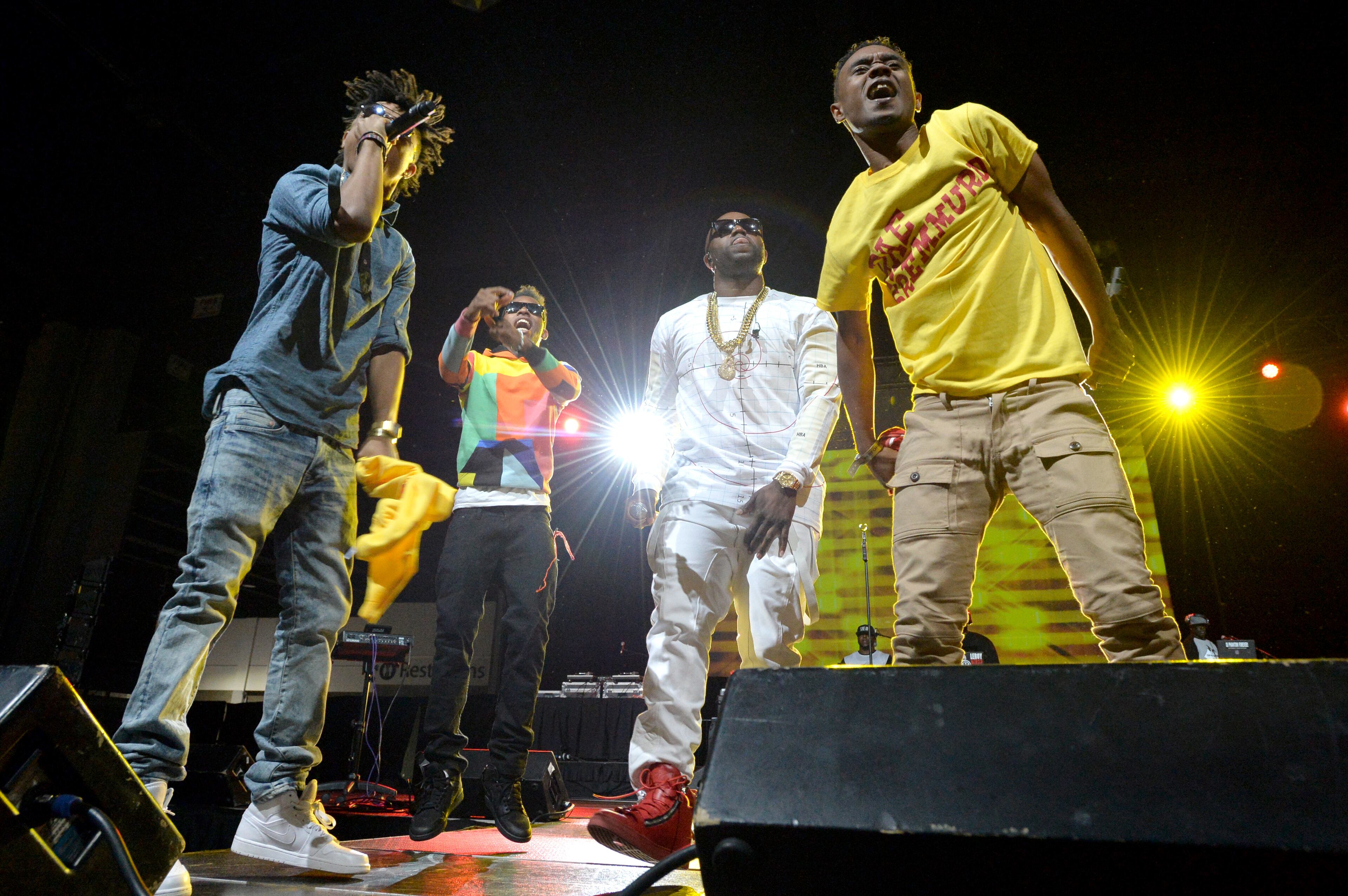 Rico Love (third from left) performs with members of Rae Sremmurd during The 2014 V-103/WAOK Car & Bike Show at the Georgia World Congress Center on Saturday, July 12, 2014.